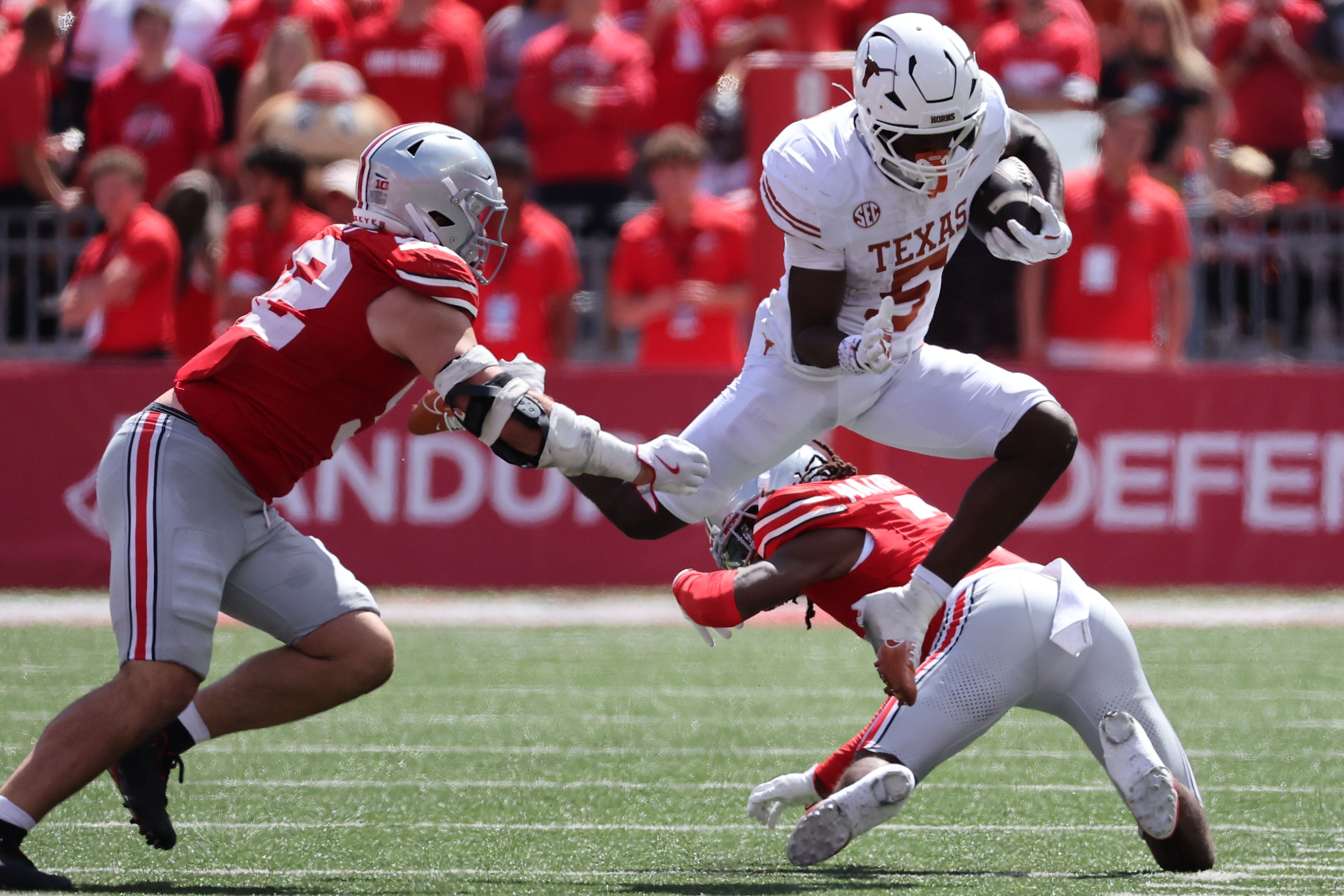 Aug 30, 2025; Columbus, Ohio, USA; Texas Longhorns running back Quintrevion Wisner (5) rushes the ball against the Ohio State Buckeyes in the first half at Ohio Stadium.