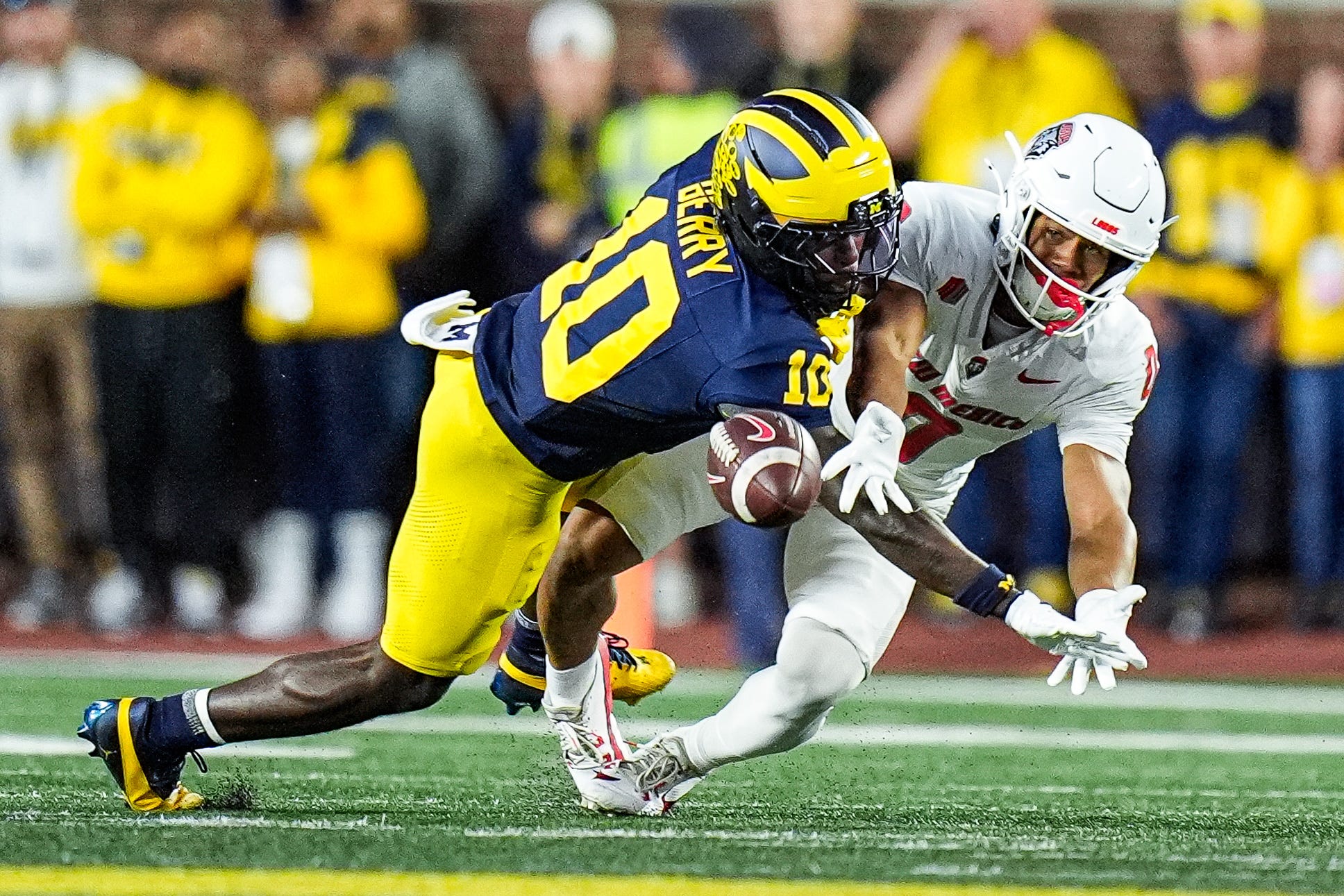 Michigan defensive back Zeke Berry (10) breaks a pass intended for New Mexico wide receiver Zhaiel Smith (0) during the first half at Michigan Stadium in Ann Arbor on Saturday, August 30, 2025.