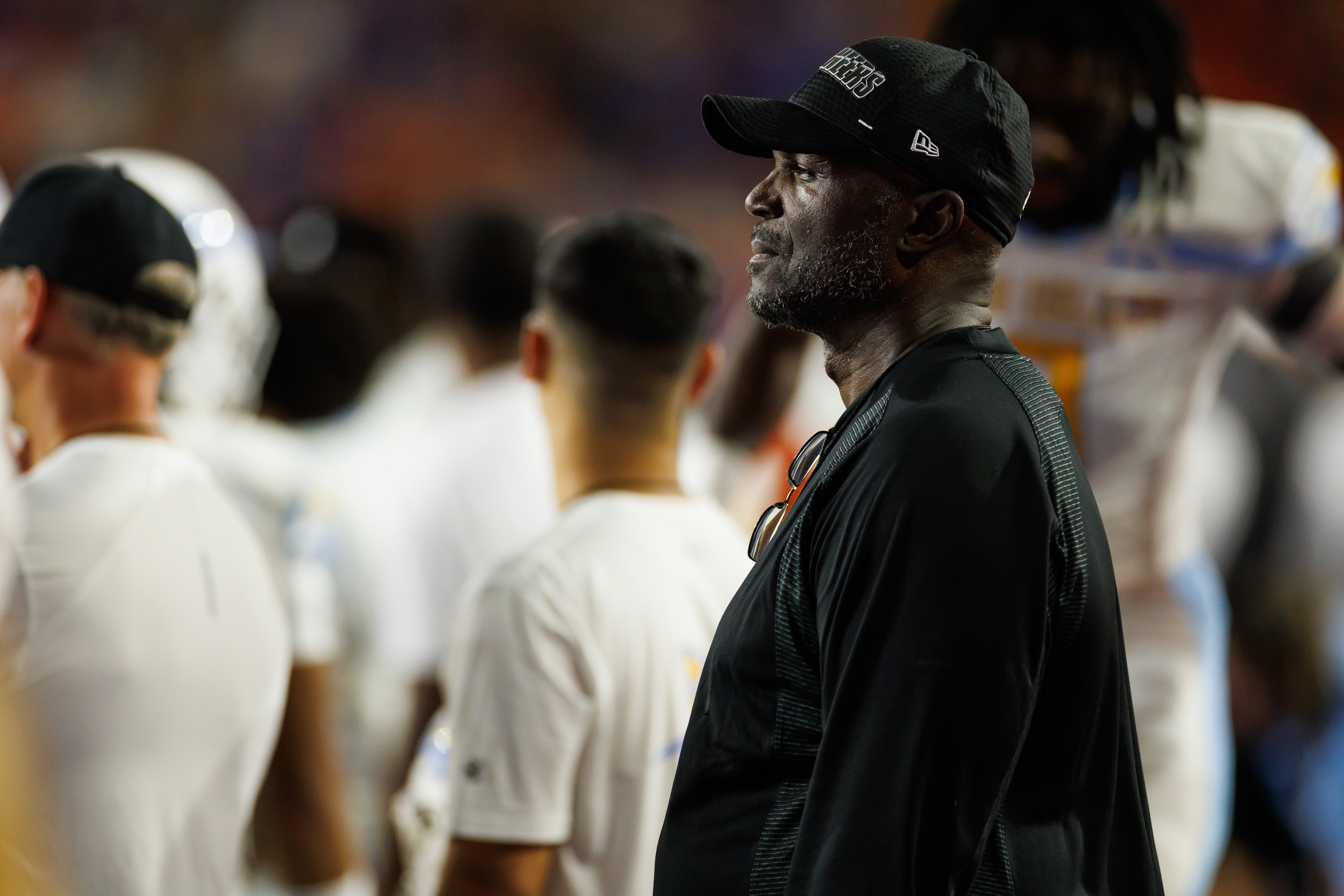 Aug 30, 2025; Gainesville, Florida, USA; Tampa Bay Buccaneers head coach Todd Bowles watches the game from the Long Island Sharks sideline against the Florida Gators during the second half at Ben Hill Griffin Stadium.