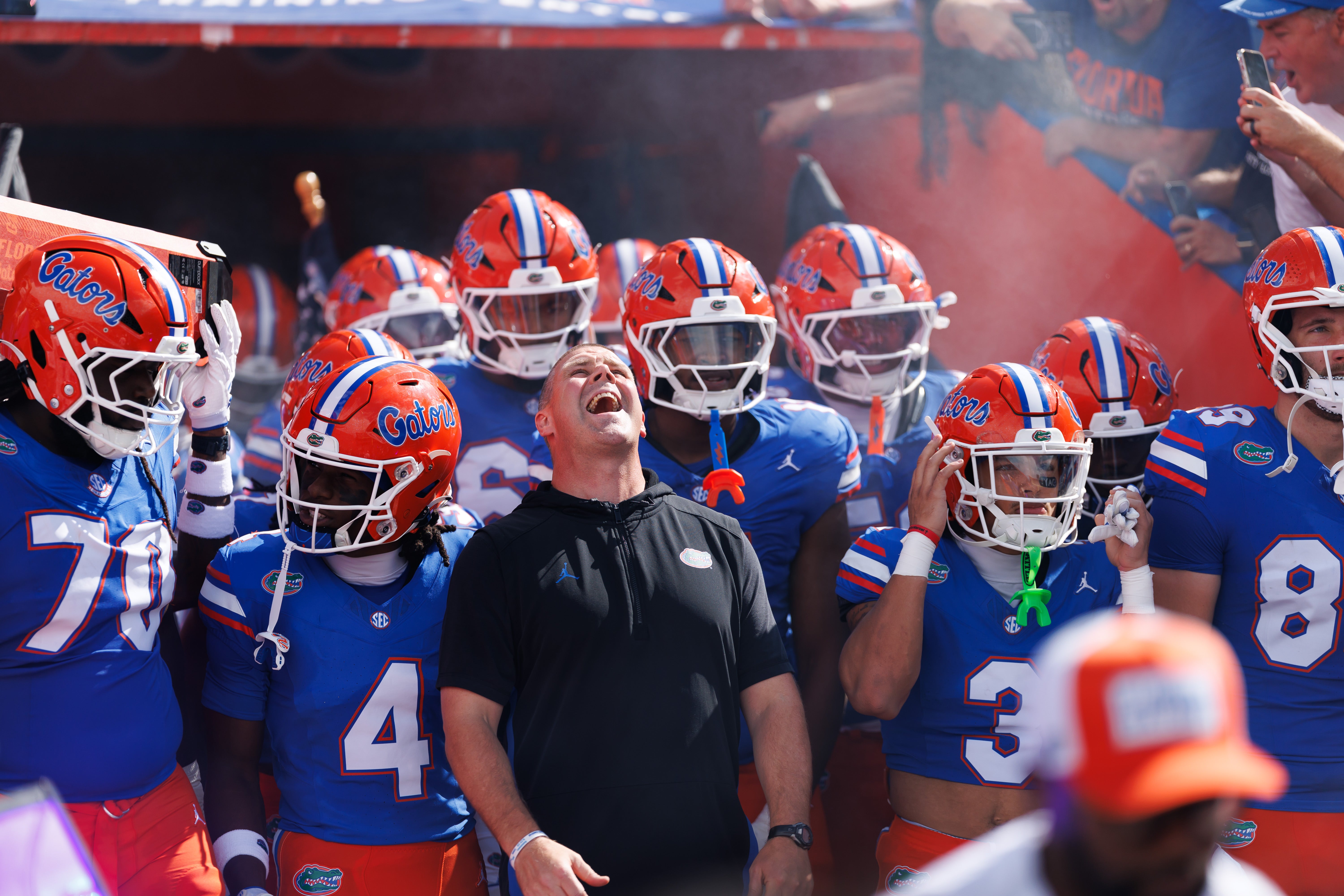 Sep 6, 2025; Gainesville, Florida, USA; Florida Gators head coach Billy Napier screams while surrounded by his team before a game against the South Florida Bulls at Ben Hill Griffin Stadium.