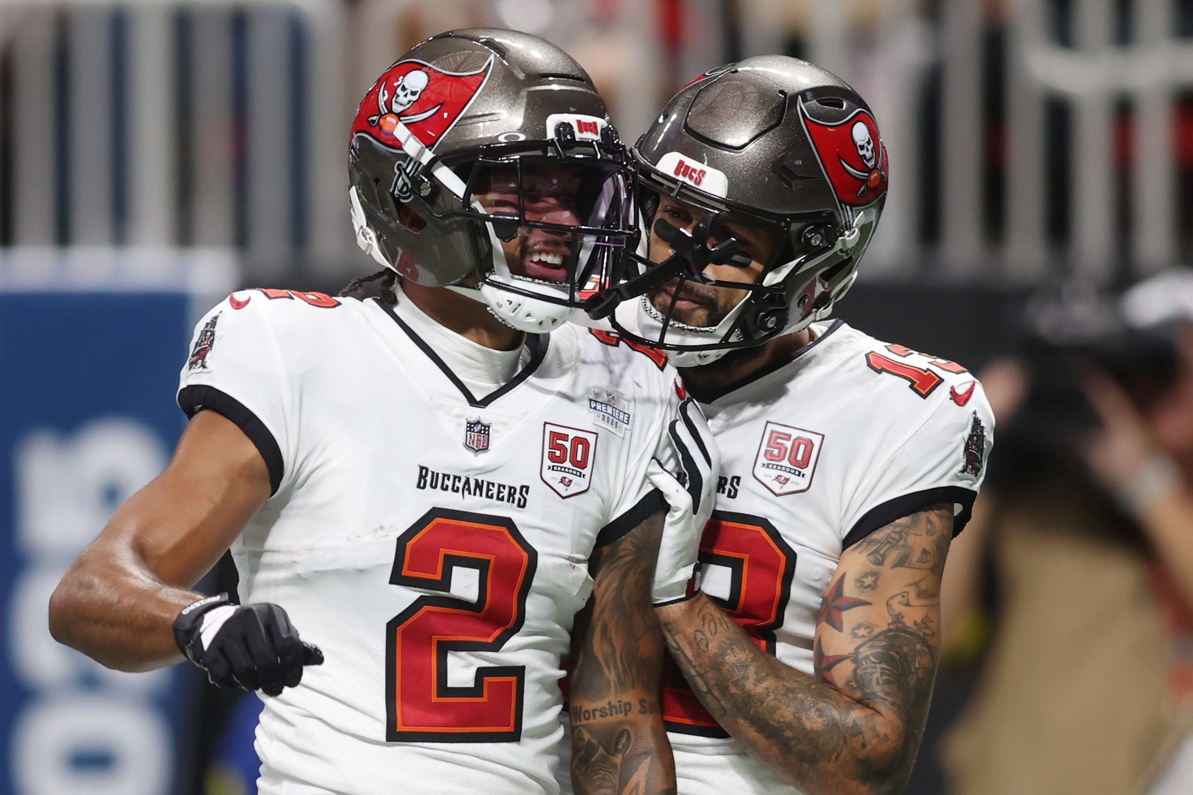 Sep 7, 2025; Atlanta, Georgia, USA; Tampa Bay Buccaneers wide receiver Emeka Egbuka (2) celebrates with wide receiver Mike Evans (13) after scoring a touchdown against the Atlanta Falcons during the second quarter at Mercedes-Benz Stadium.