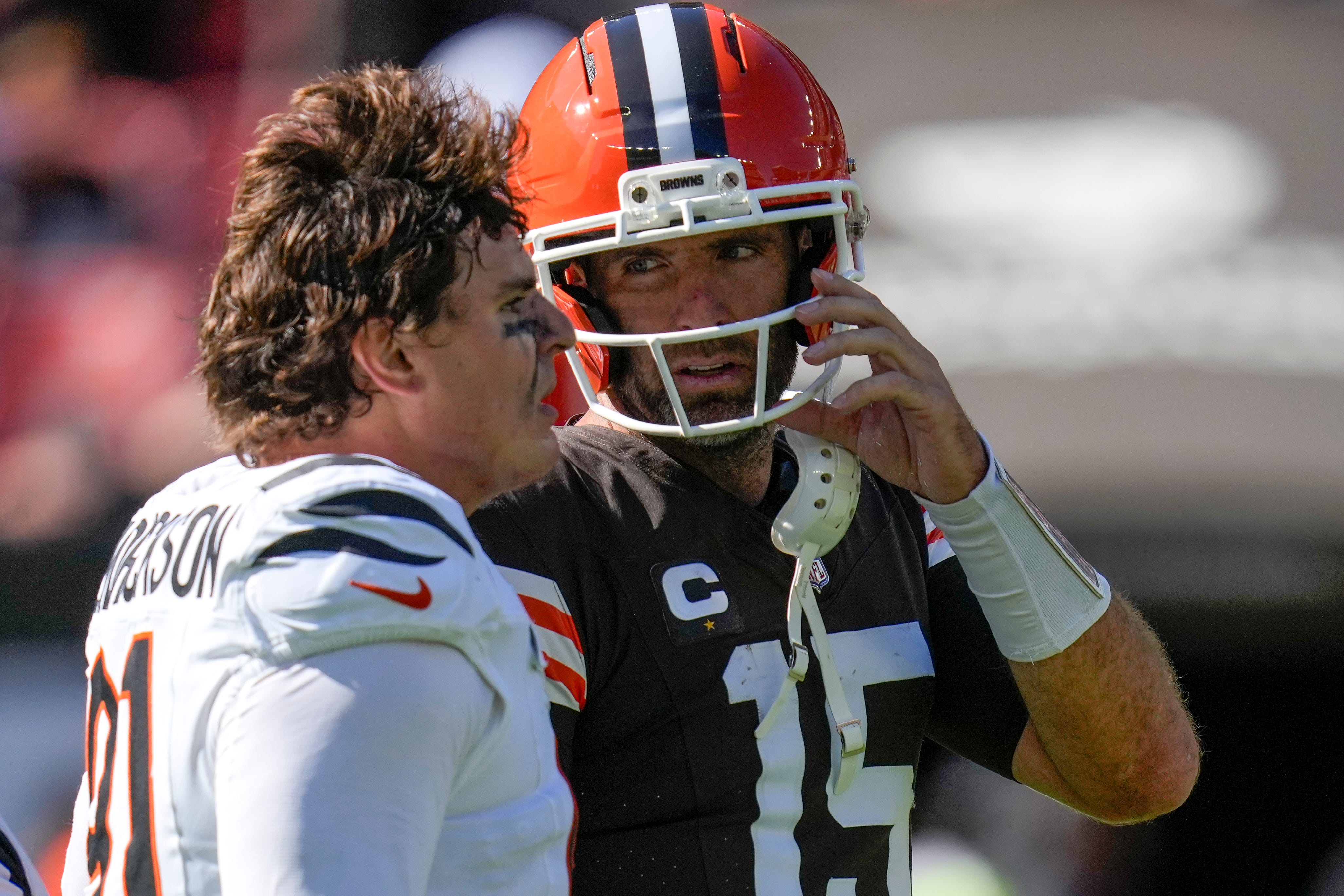 Cincinnati Bengals defensive end Trey Hendrickson (91) and Cleveland Browns quarterback Joe Flacco (15) talk after the fourth quarter of the NFL Week 1 game between the Cleveland Browns and the Cincinnati Bengals at Huntington Bank Field in Cleveland on Sunday, Sept. 7, 2025. The Bengals begin the season with a 17-16 win over the Browns.