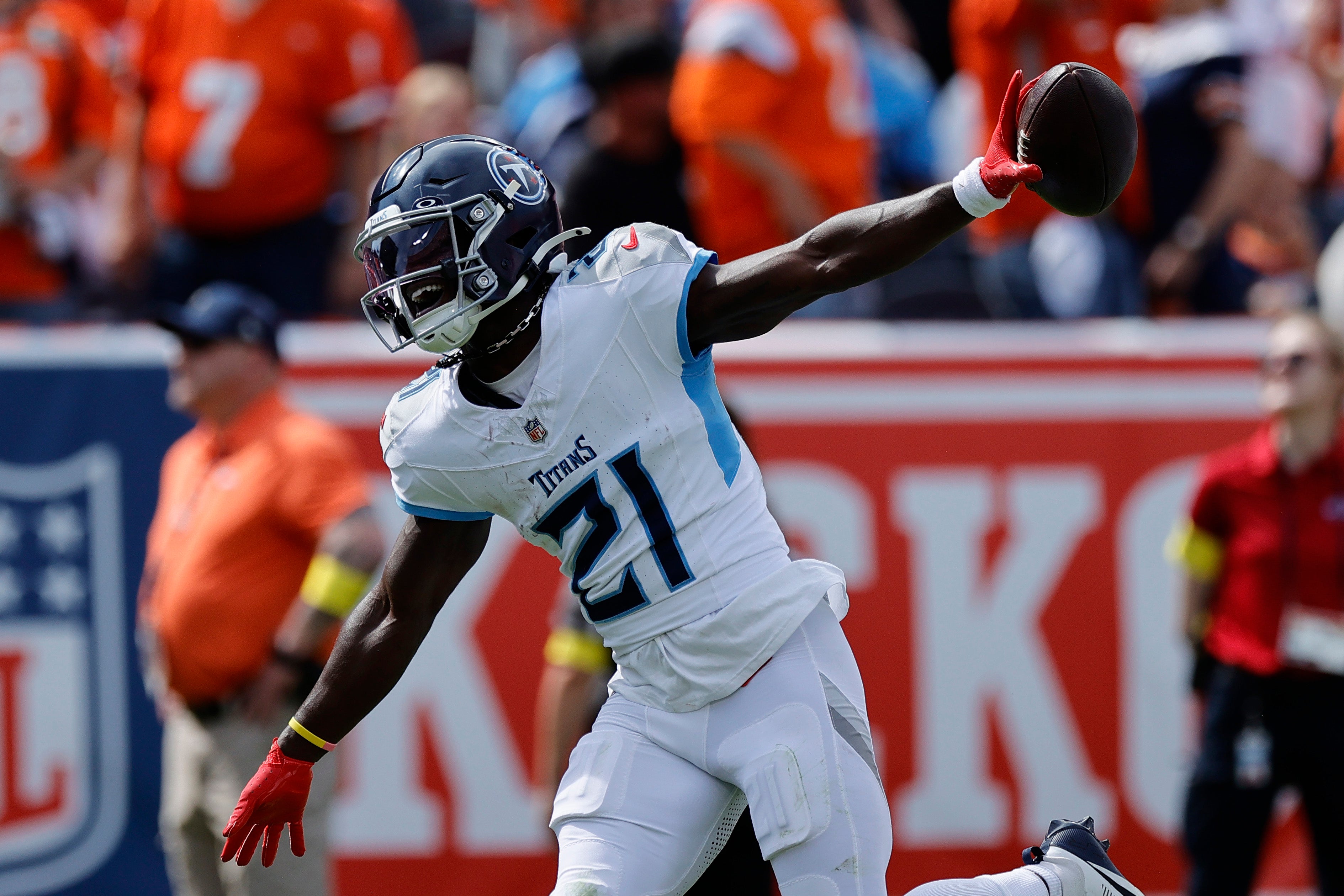 Sep 7, 2025; Denver, Colorado, USA; Tennessee Titans cornerback Roger McCreary (21) reacts after an interception against the Denver Broncos in the first half at Empower Field at Mile High.