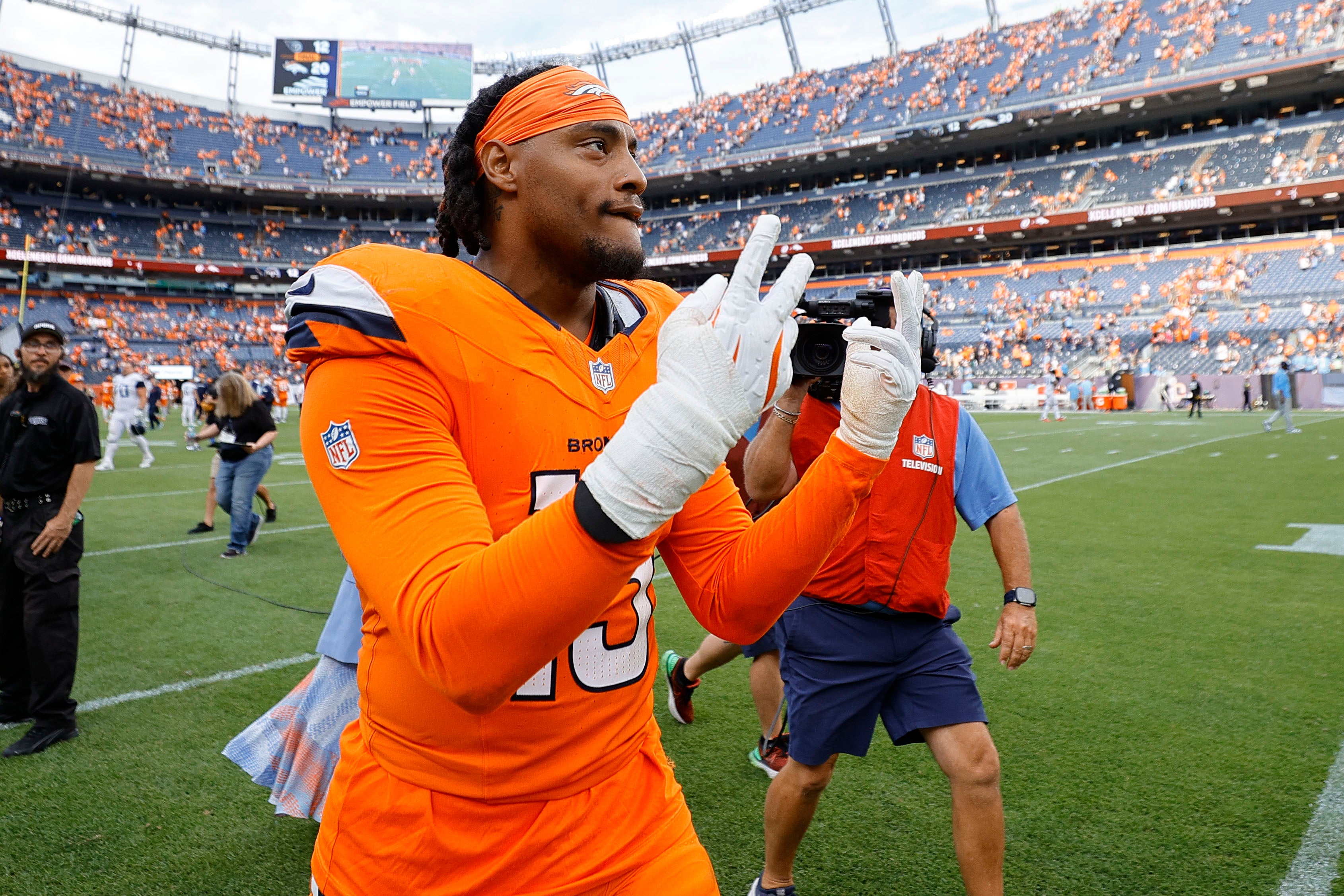 Sep 7, 2025; Denver, Colorado, USA; Denver Broncos linebacker Nik Bonitto (15) reacts after the game at Empower Field at Mile High.