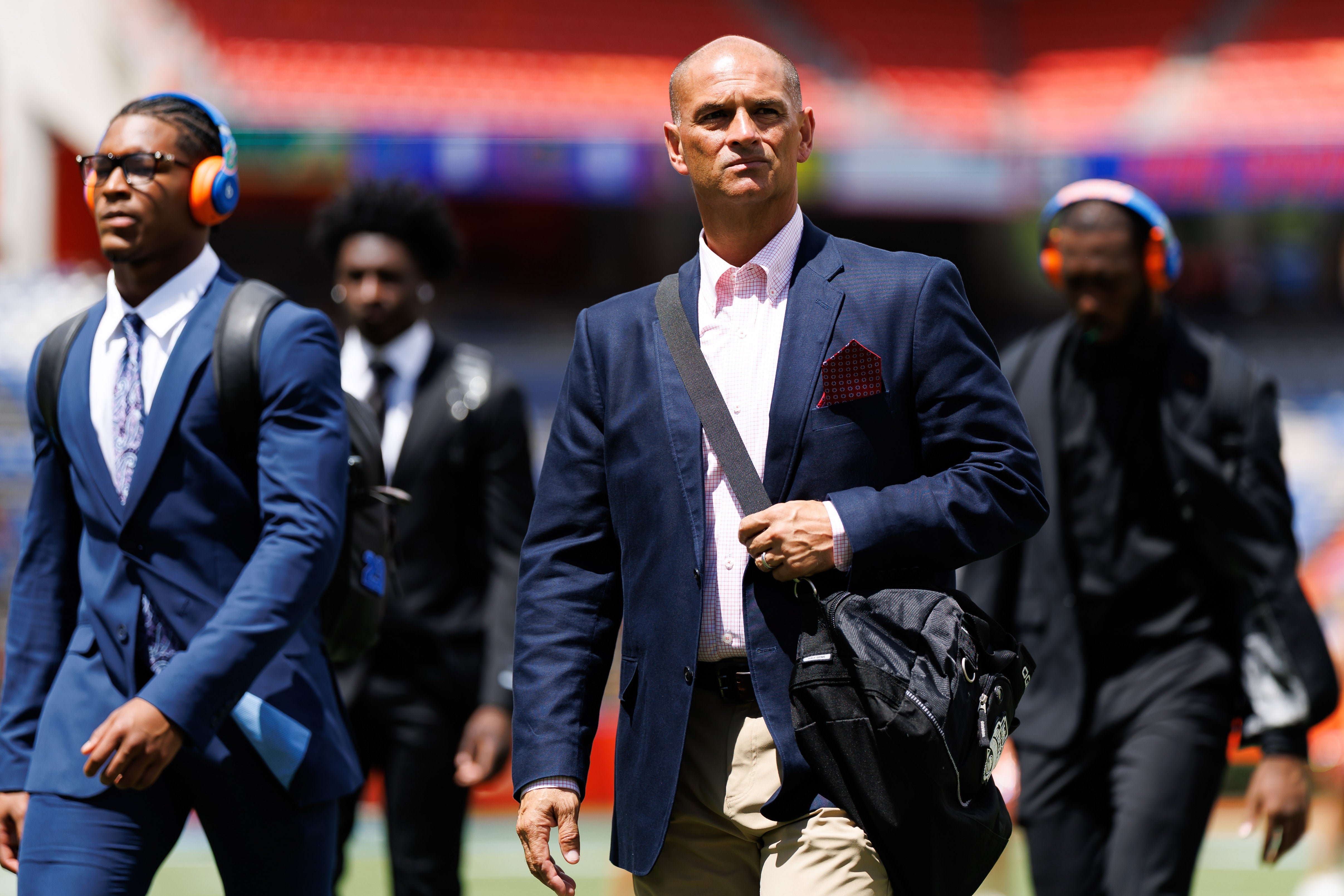 Sep 6, 2025; Gainesville, Florida, USA; Florida Gators assistant coach for wide receivers Billy Gonzales walks on the field during Gator Walk before a game against the South Florida Bulls at Ben Hill Griffin Stadium.