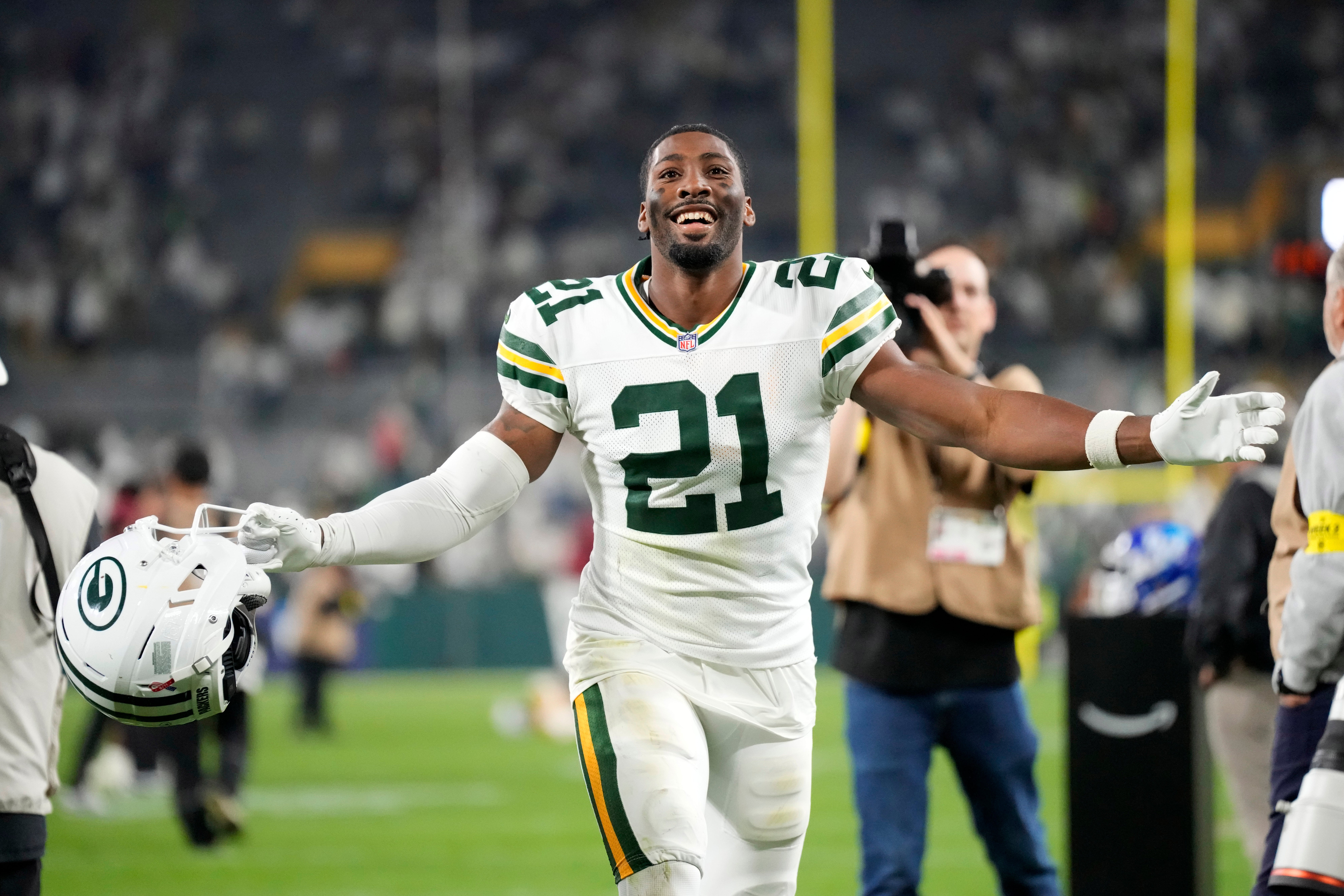 Sep 11, 2025; Green Bay, Wisconsin, USA; Green Bay Packers cornerback Nate Hobbs (21) celebrates after defeating the Washington Commanders at Lambeau Field.