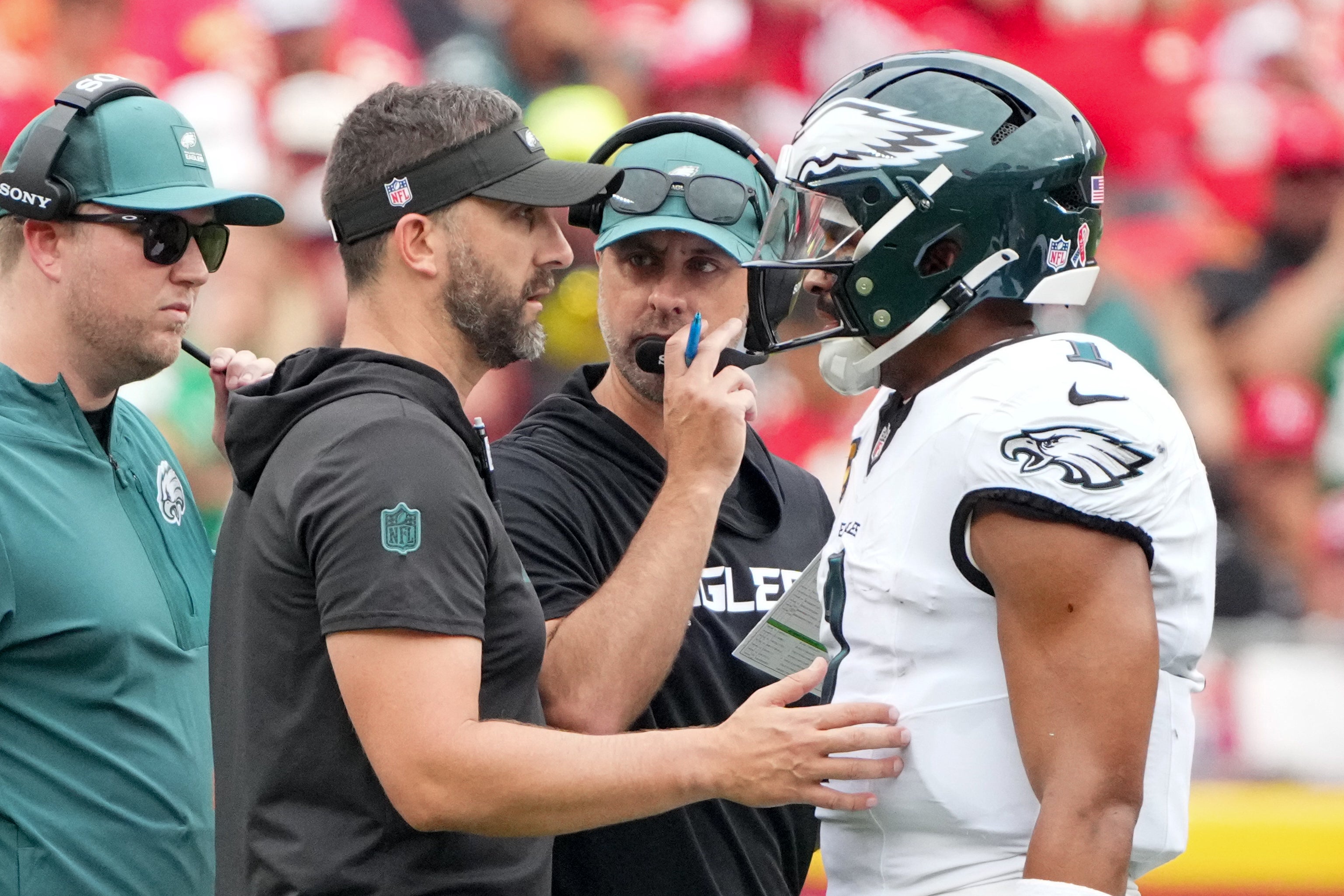 Philadelphia Eagles head coach Nick Sirianni and offenisve coordinator Kevin Patullo speak with Philadelphia Eagles quarterback Jalen Hurts (1) during the second quarter of the game against the Kansas.
