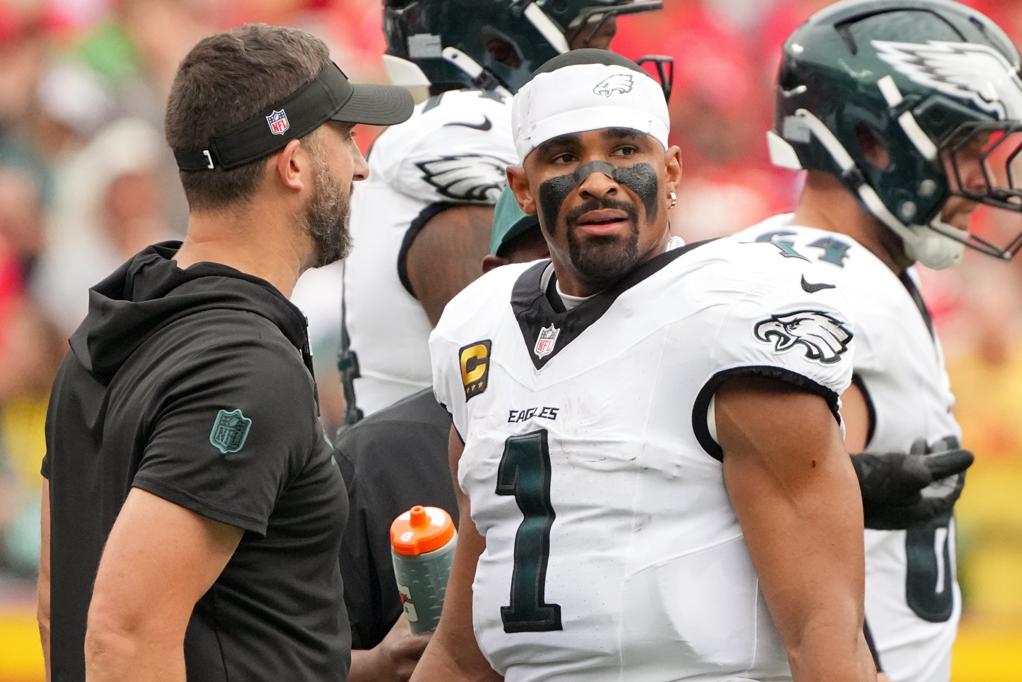 Philadelphia Eagles head coach Nick Sirianni speaks with quarterback Jalen Hurts (1) during the second quarter of the game against the Kansas City Chiefs at GEHA Field at Arrowhead Stadium.