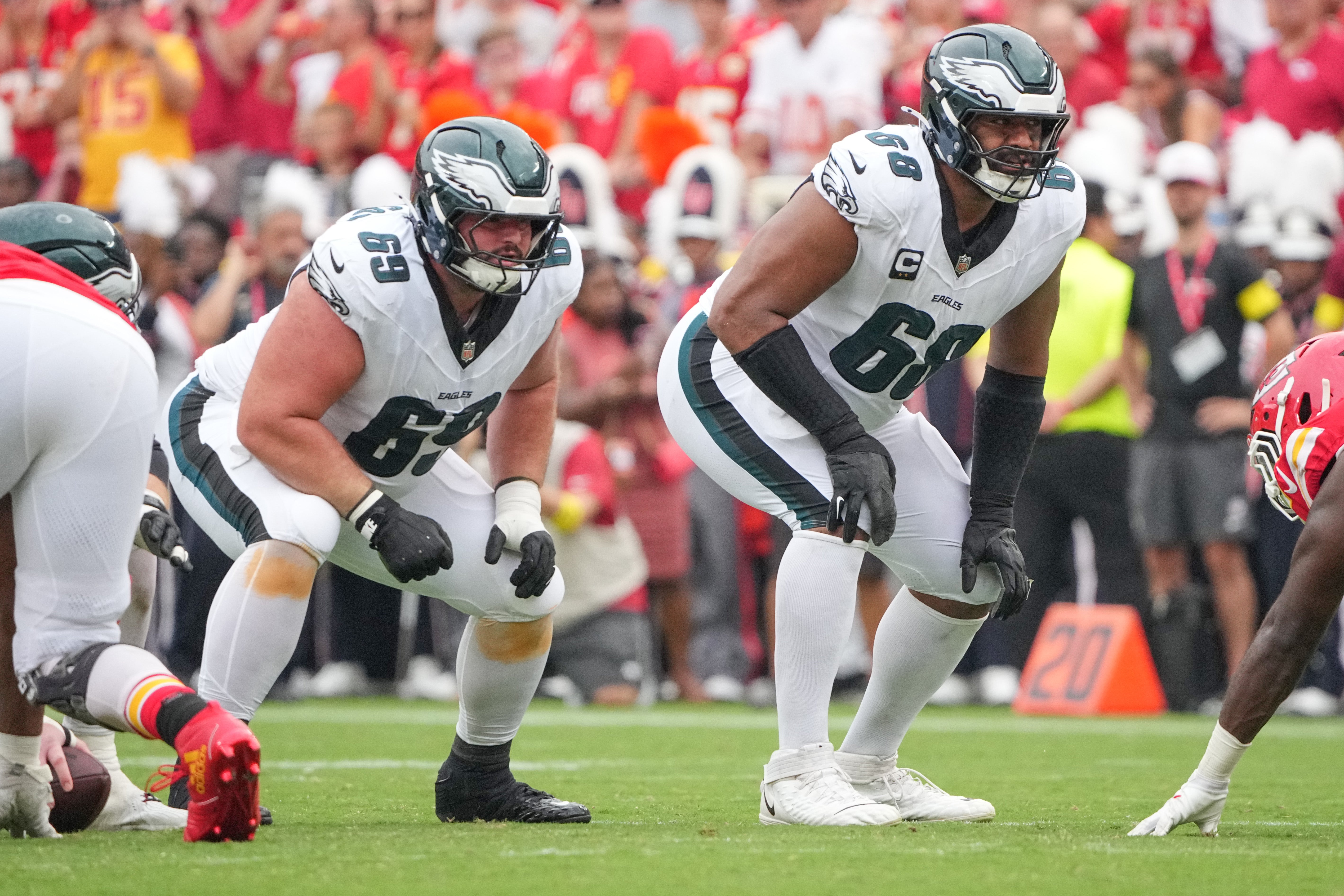 Philadelphia Eagles guard Landon Dickerson (69) and offensive tackle Jordan Mailata (68) on the line of scrimmage against the Kansas City Chiefs during the game at GEHA Field at Arrowhead Stadium.
