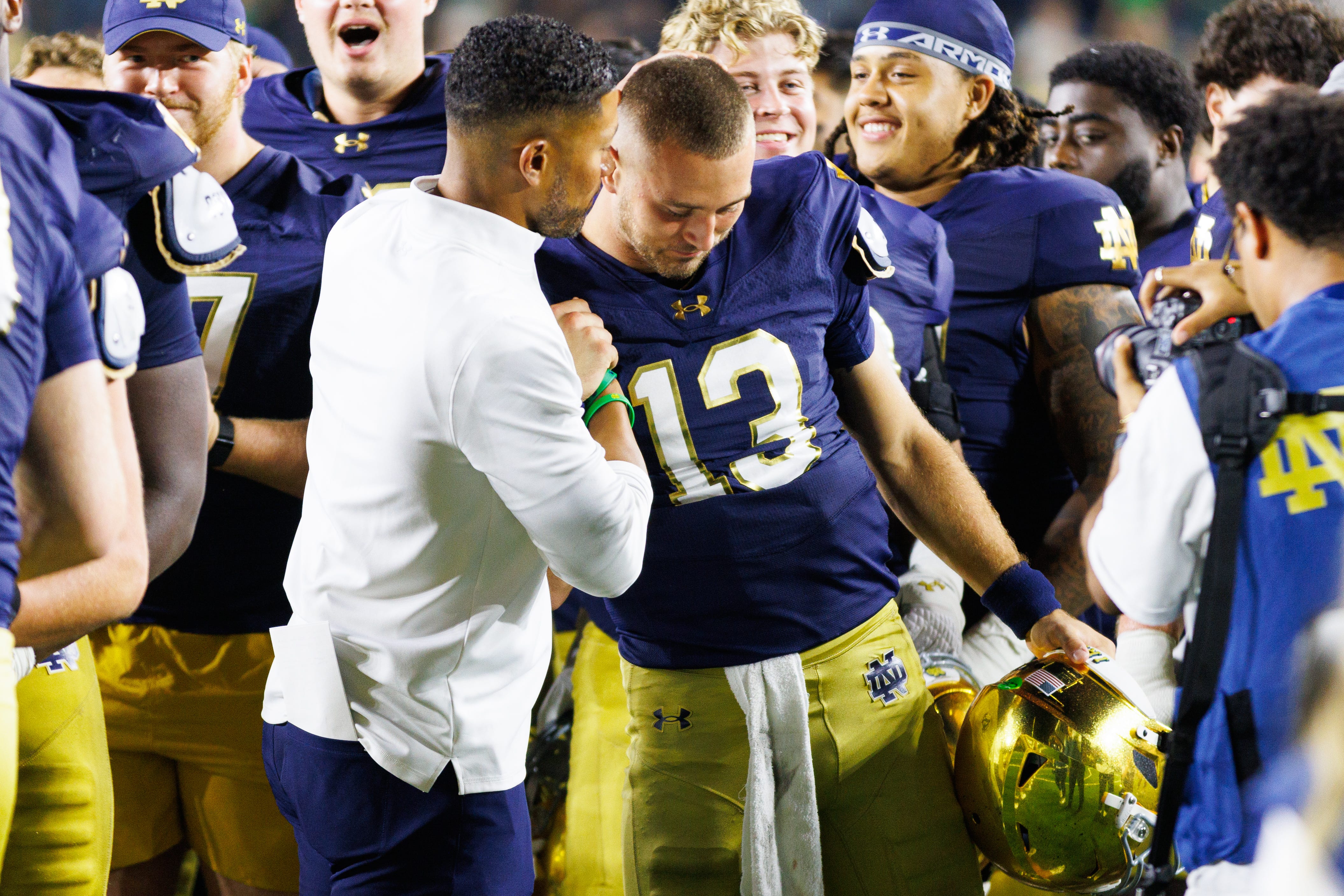 Notre Dame head coach Marcus Freeman, left, celebrates with quarterback CJ Carr (13) after winning a NCAA football game 56-30 against Purdue at Notre Dame Stadium on Saturday, Sept. 20, 2025, in South Bend.