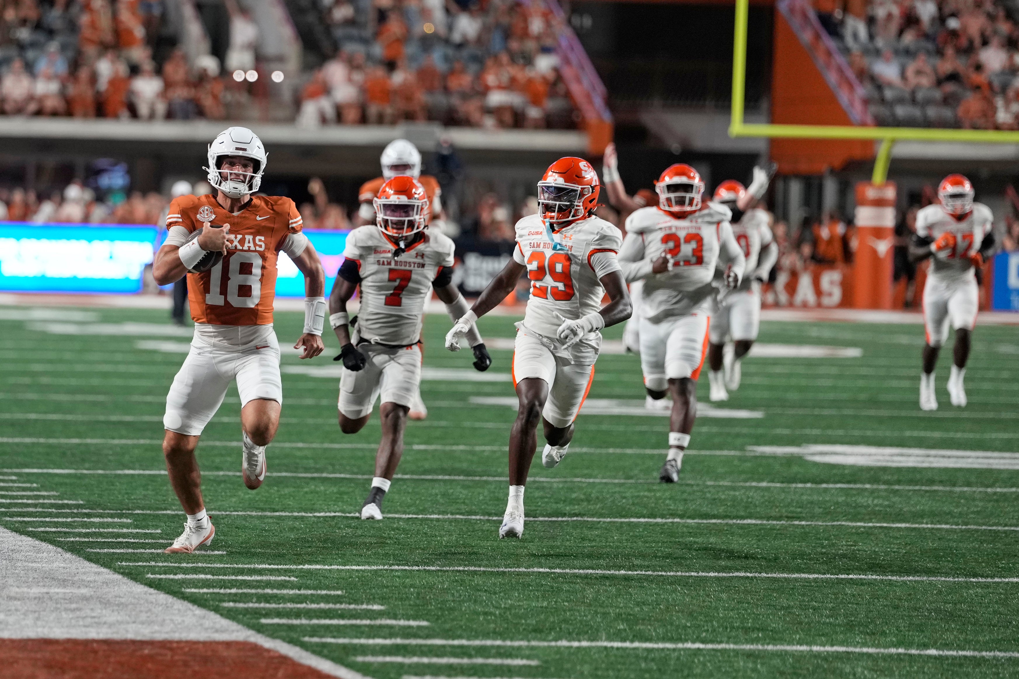 Sep 20, 2025; Austin, Texas, USA; Texas Longhorns quarterback Matthew Caldwell (18) runs for a long gain after keeping the ball during the second half against the Sam Houston Bearkats at Darrell K Royal-Texas Memorial Stadium. Mandatory Credit: Scott Wachter-Imagn Images