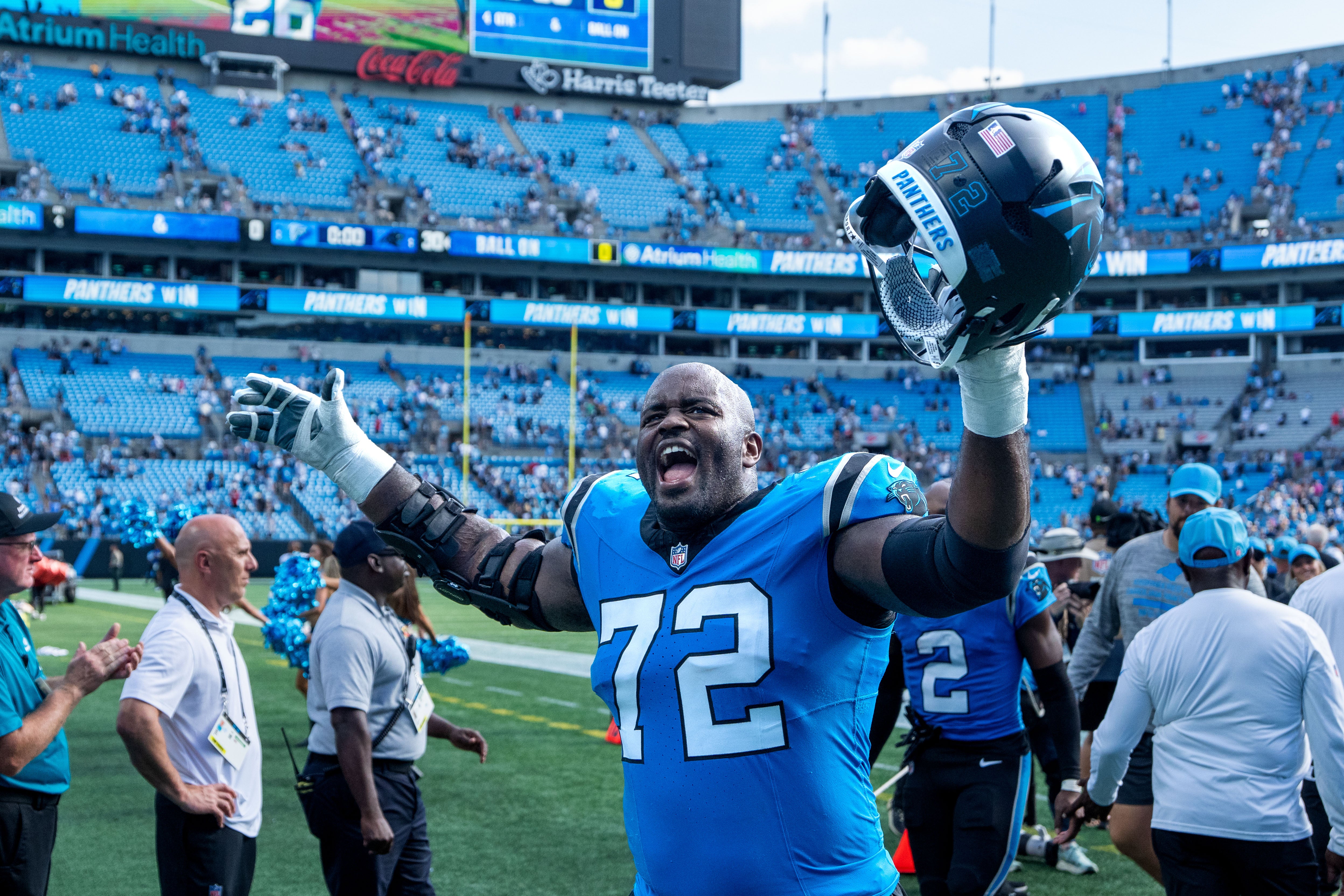 Sep 21, 2025; Charlotte, North Carolina, USA; Carolina Panthers offensive tackle Taylor Moton (72) reacts after the game at Bank of America Stadium.