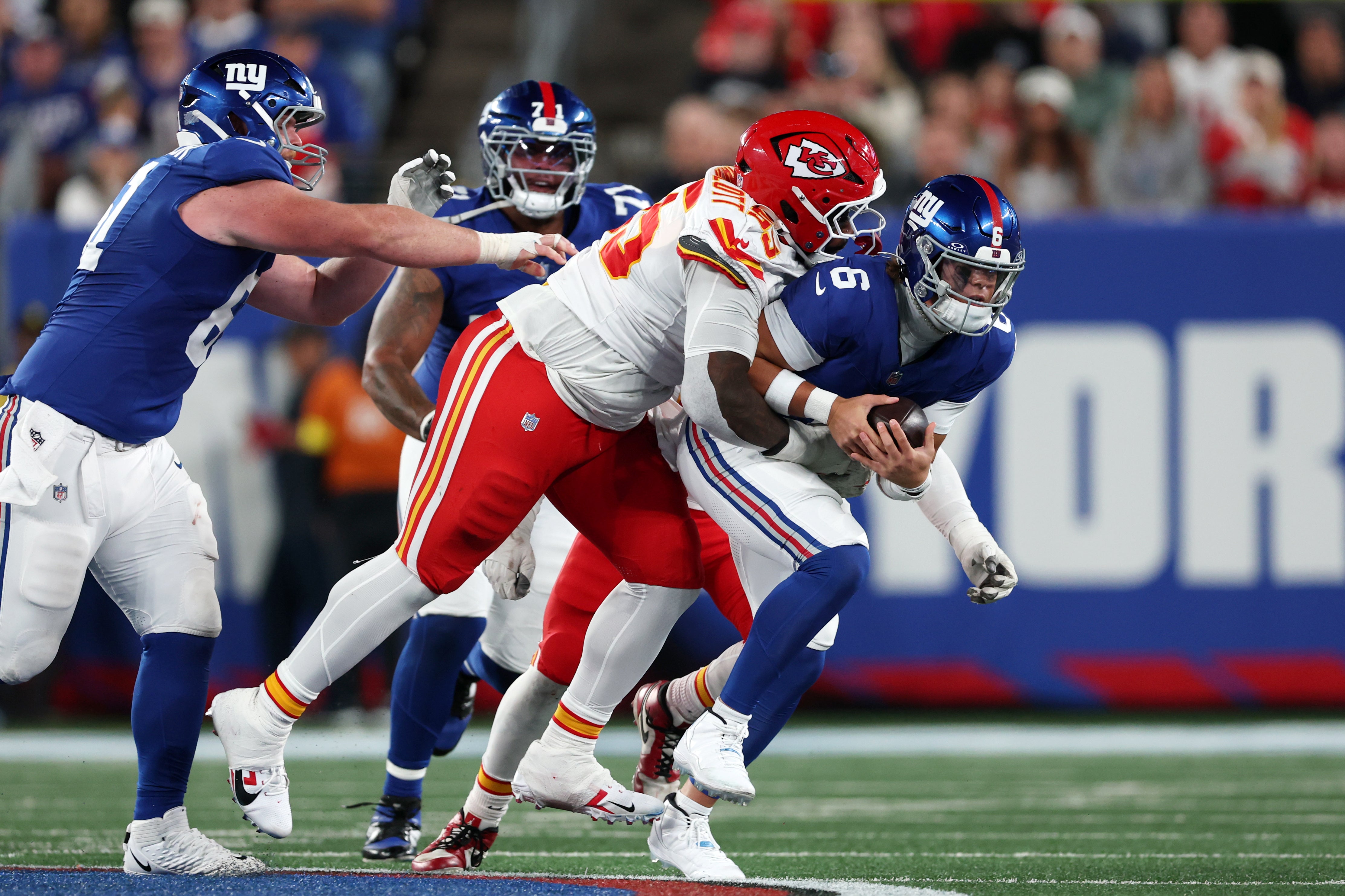 Kansas City Chiefs defensive tackle Omarr Norman-Lott (55) tackles New York Giants quarterback Jaxson Dart (6)