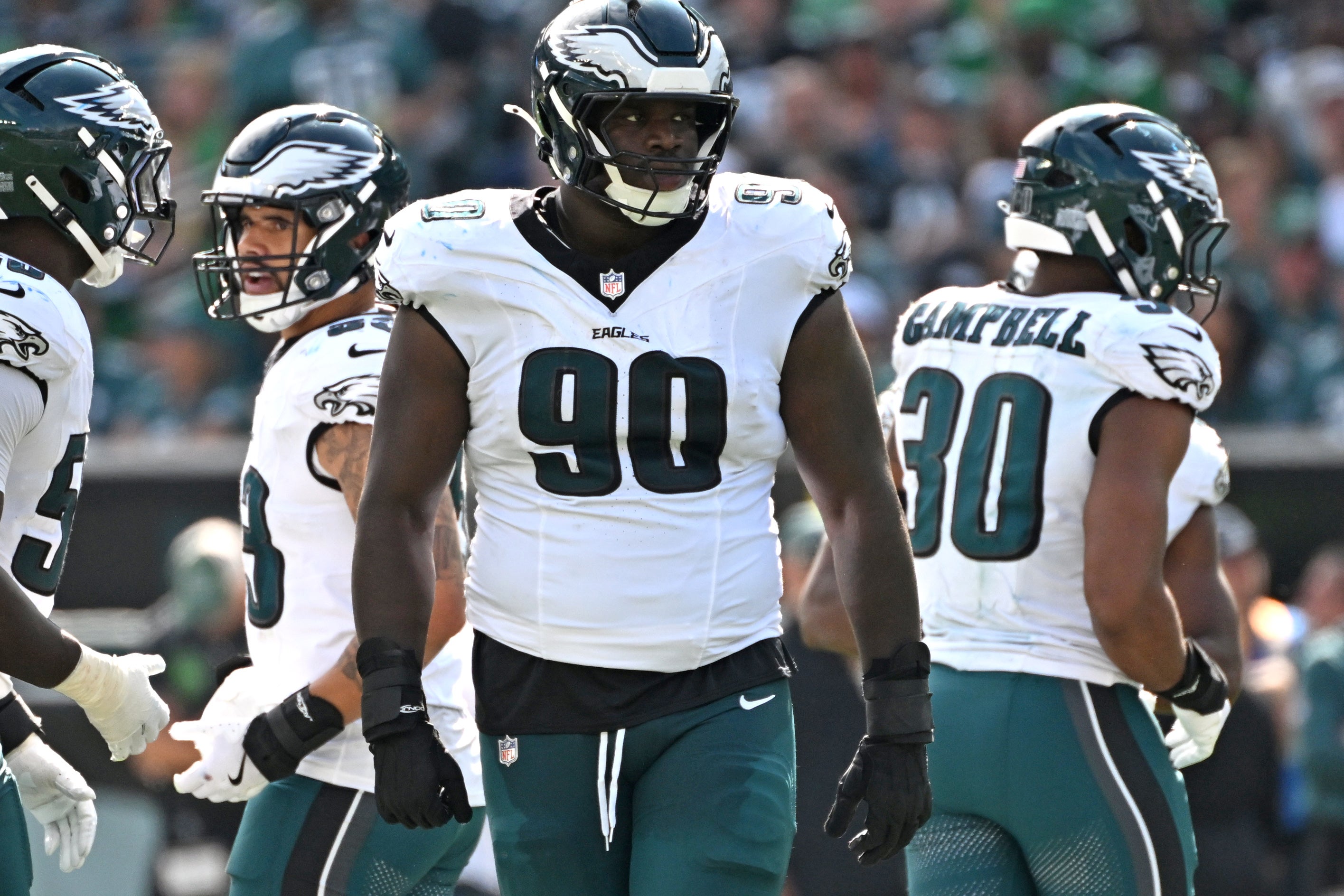 Philadelphia Eagles defensive tackle Jordan Davis (90) and teammates against the Los Angeles Rams at Lincoln Financial Field.