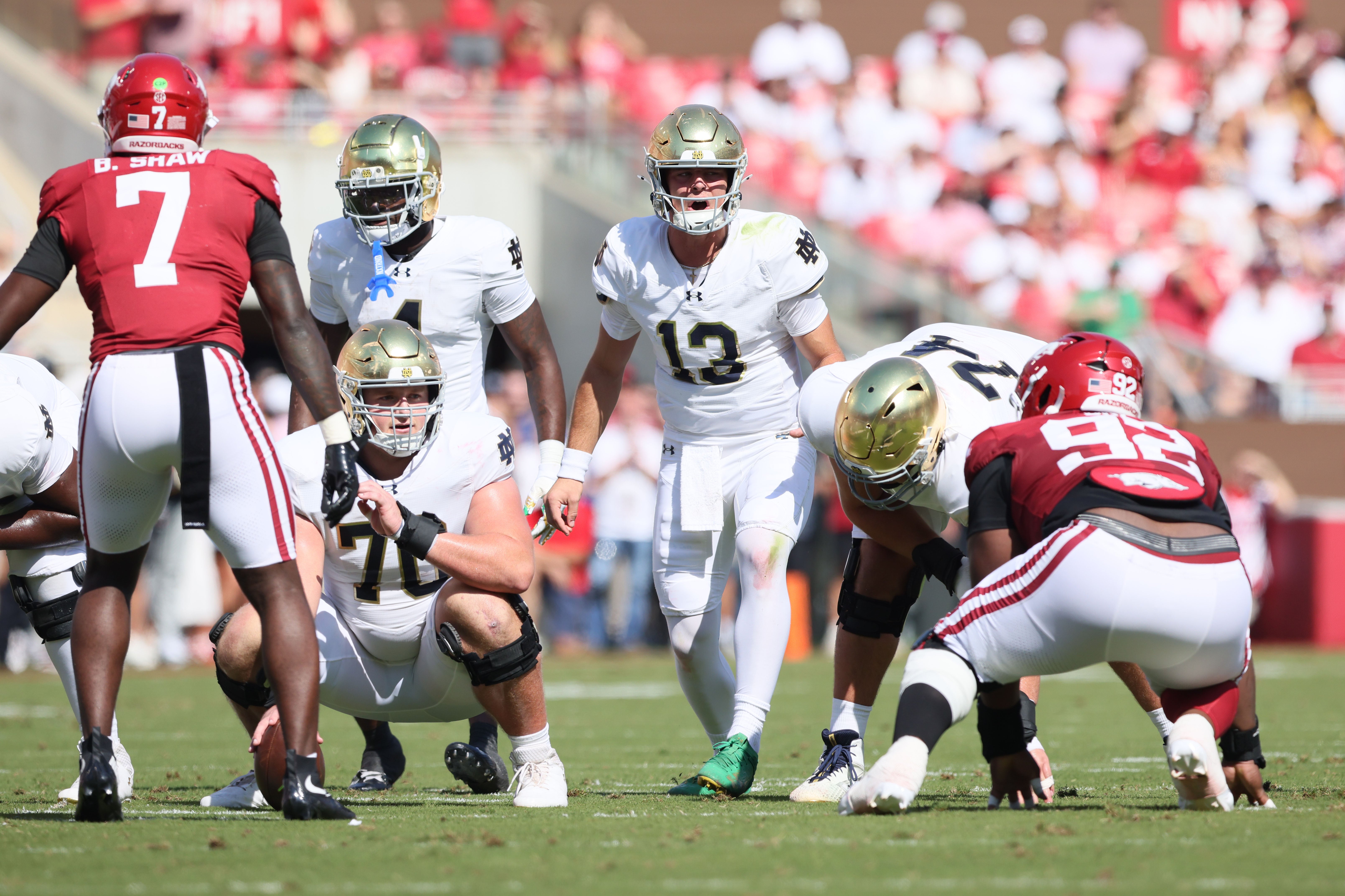 Sep 27, 2025; Fayetteville, Arkansas, USA; Notre Dame Fighting Irish quarterback CJ Carr (13) audibles at the line during the first quarter against the Arkansas Razorbacks at Donald W. Reynolds Razorback Stadium. Mandatory Credit: Nelson Chenault-Imagn Images