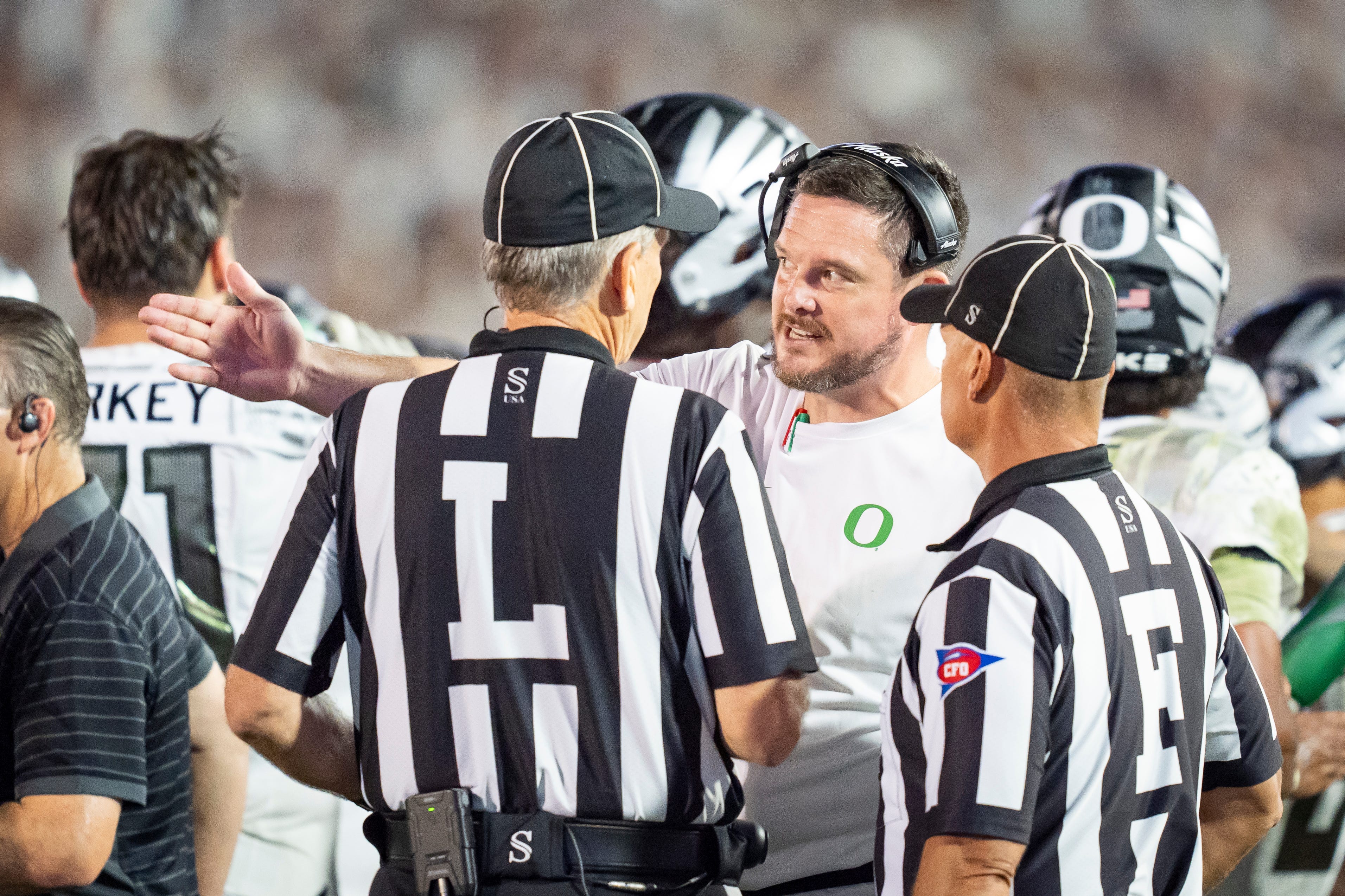 Oregon head coach Dan Lanning talks to the officials in the fourth quarter as the Oregon Ducks face the Penn State Nittany Lions on Sept. 27, 2025, at Beaver Stadium in University Park, Pennsylvania.