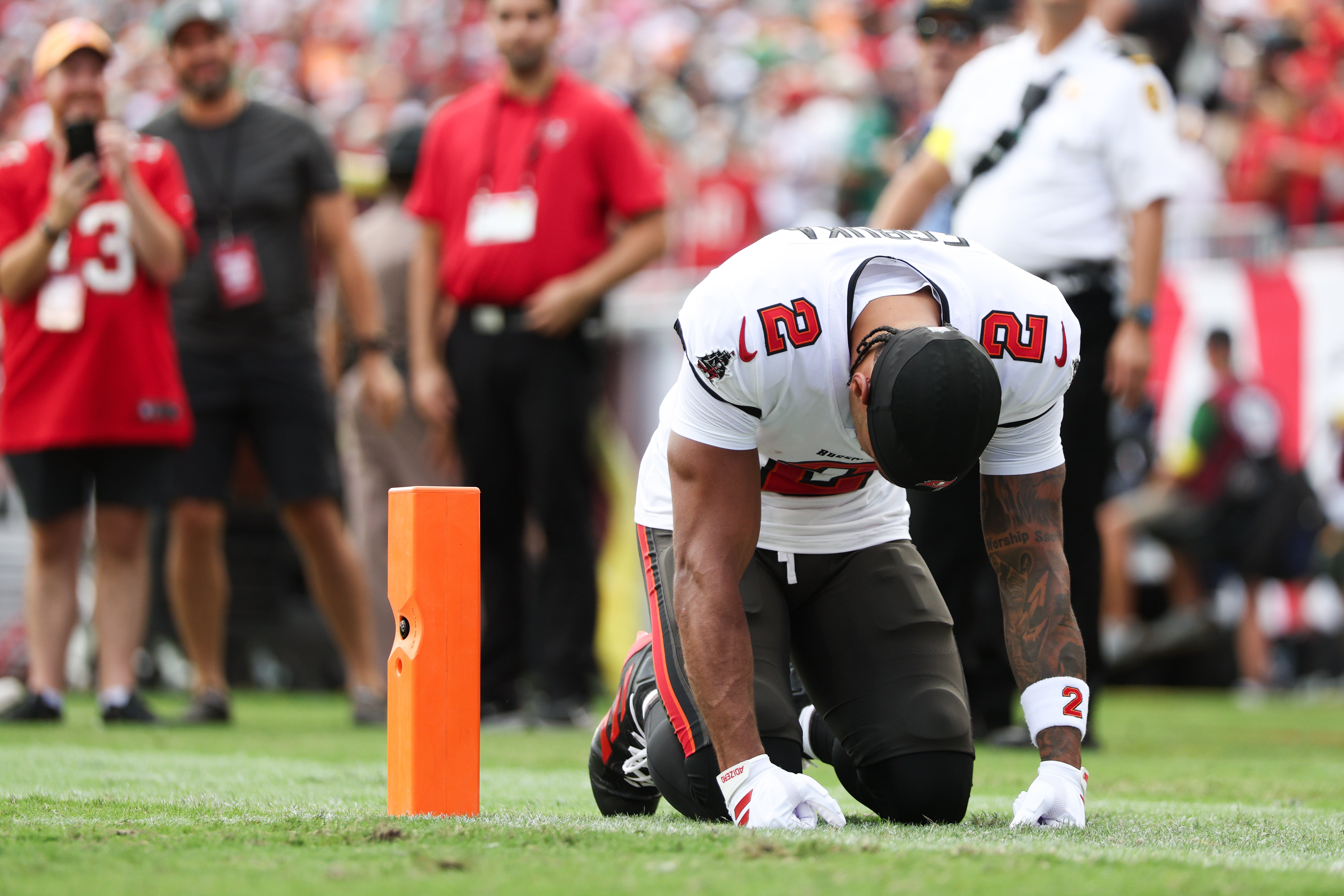 Sep 28, 2025; Tampa, Florida, USA; Tampa Bay Buccaneers wide receiver Emeka Egbuka (2) kneels at the end zone before the start of the game against the Philadelphia Eagles at Raymond James Stadium.