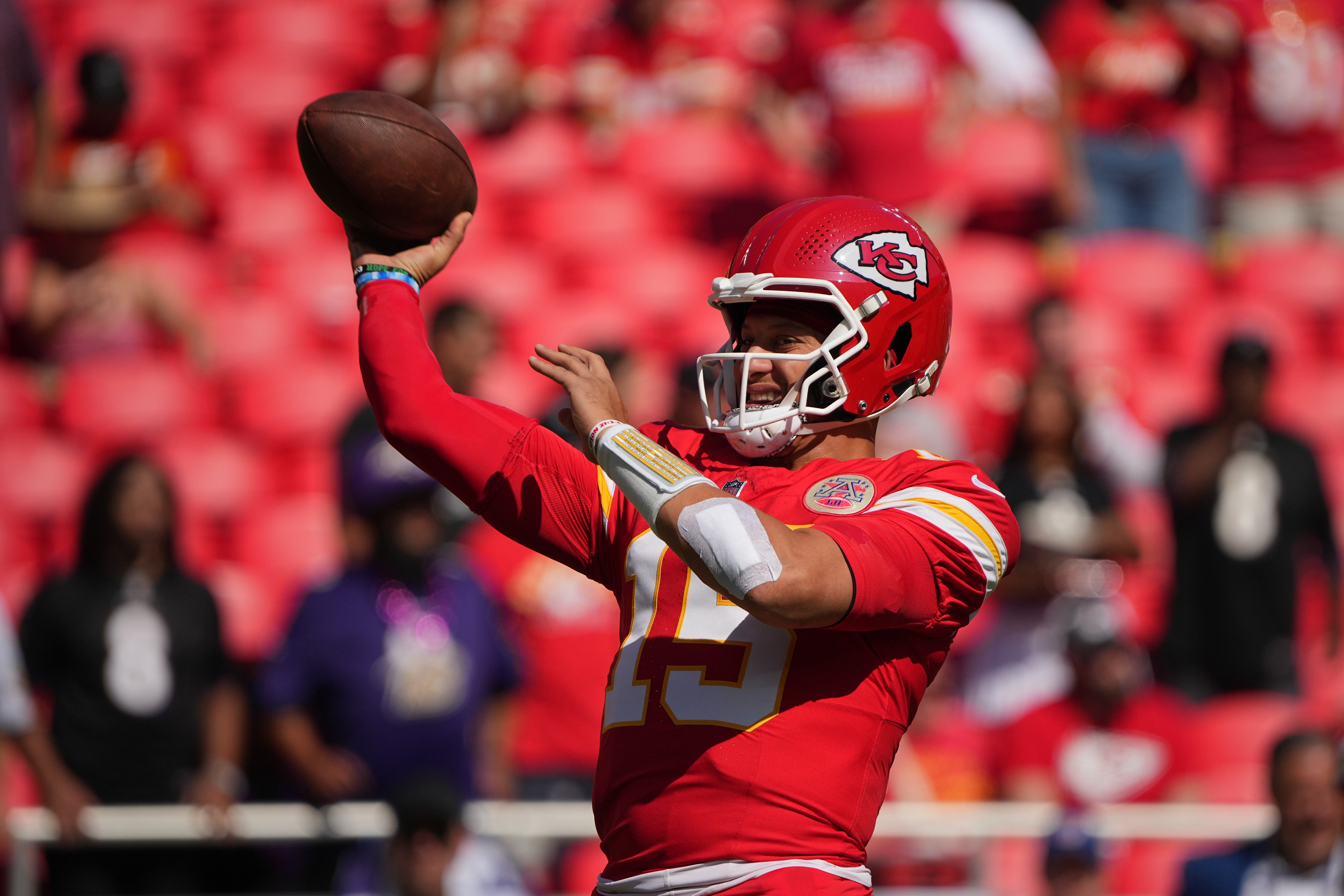 Kansas City Chiefs quarterback Patrick Mahomes (15) warms up before the game against the Baltimore Ravens at GEHA Field at Arrowhead Stadium.