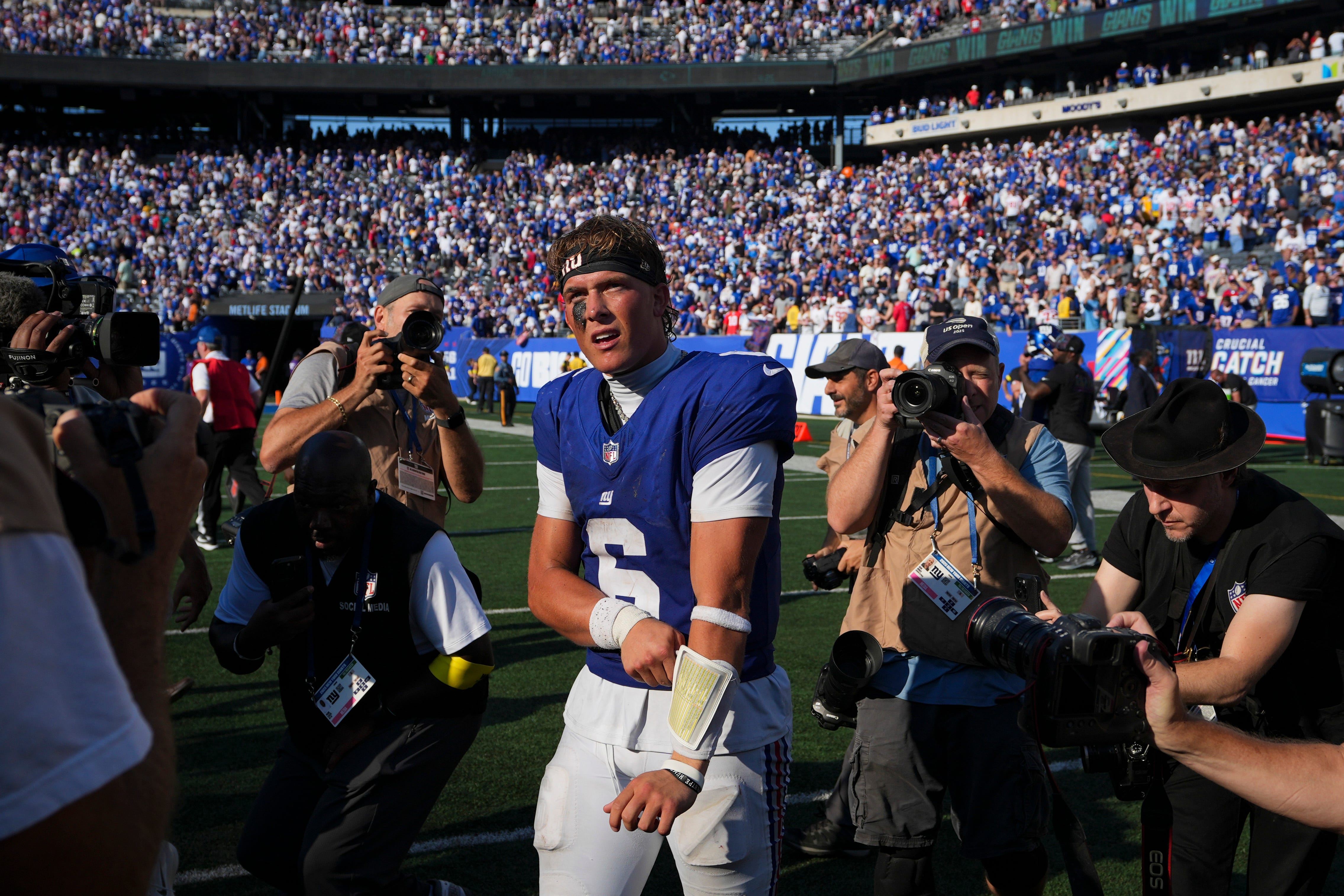 New York Giants quarterback Jaxson Dart (6) walks on the field after defeating the Los Angeles Chargers at MetLife Stadium, Sep 28, 2025, East Rutherford, NJ, USA.