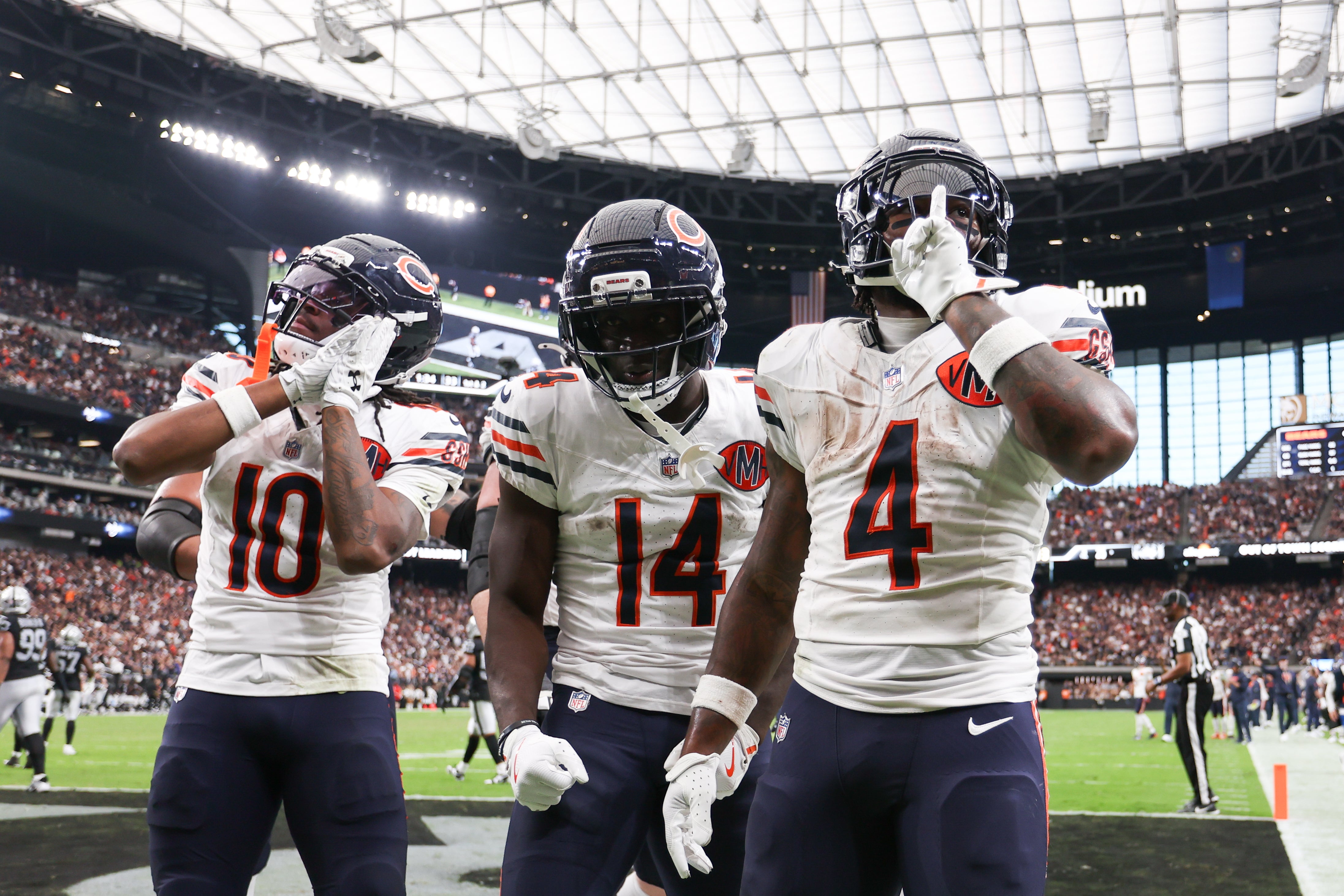 Sep 28, 2025; Paradise, Nevada, USA; Chicago Bears running back D'Andre Swift (4) celebrates a touchdown with wide receiver Olamide Zaccheaus (14) during the second half against the Las Vegas Raiders at Allegiant Stadium.