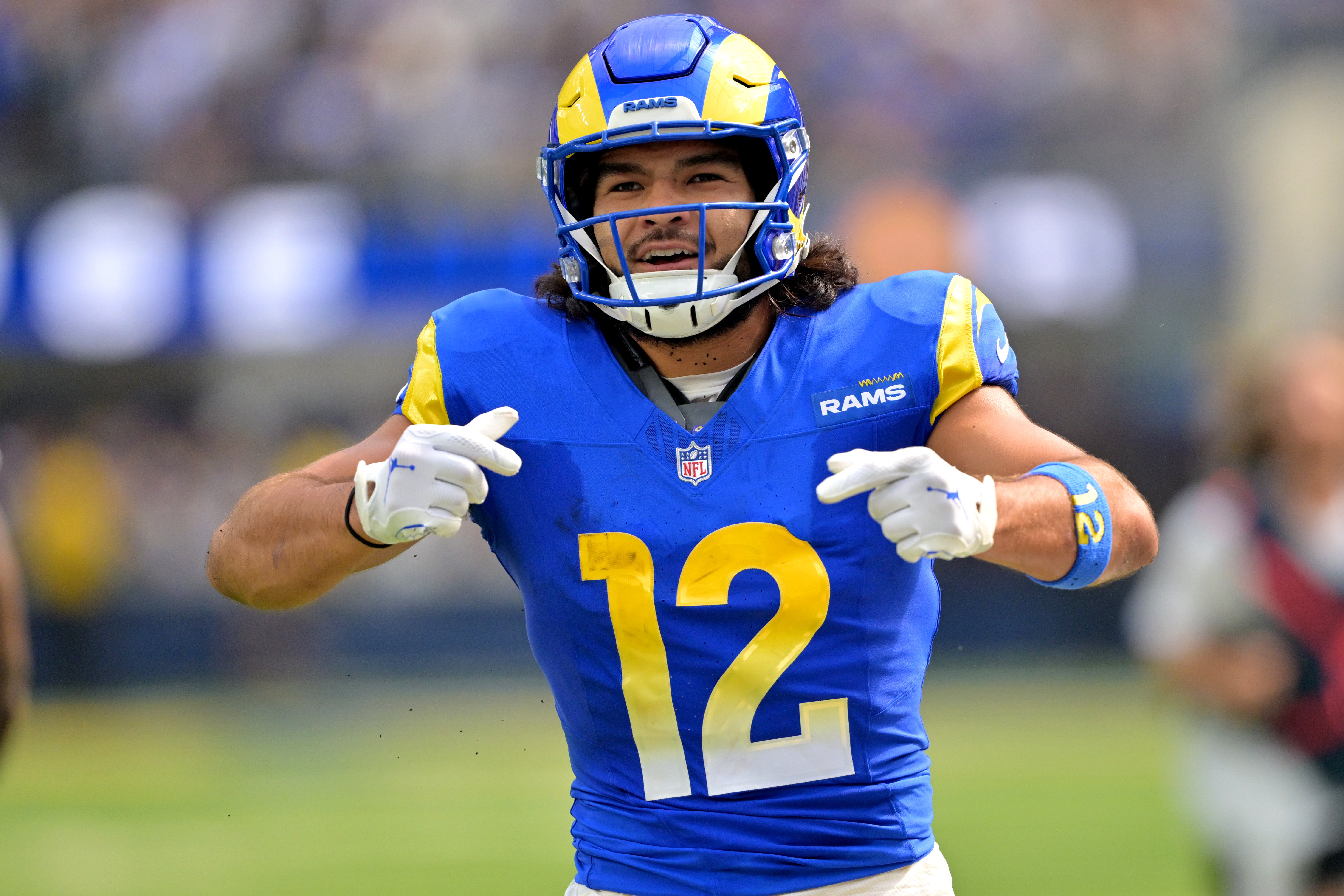 Los Angeles Rams wide receiver Puka Nacua (12) celebrates after a complete pass and first down during the first half against the Indianapolis Colts at SoFi Stadium.