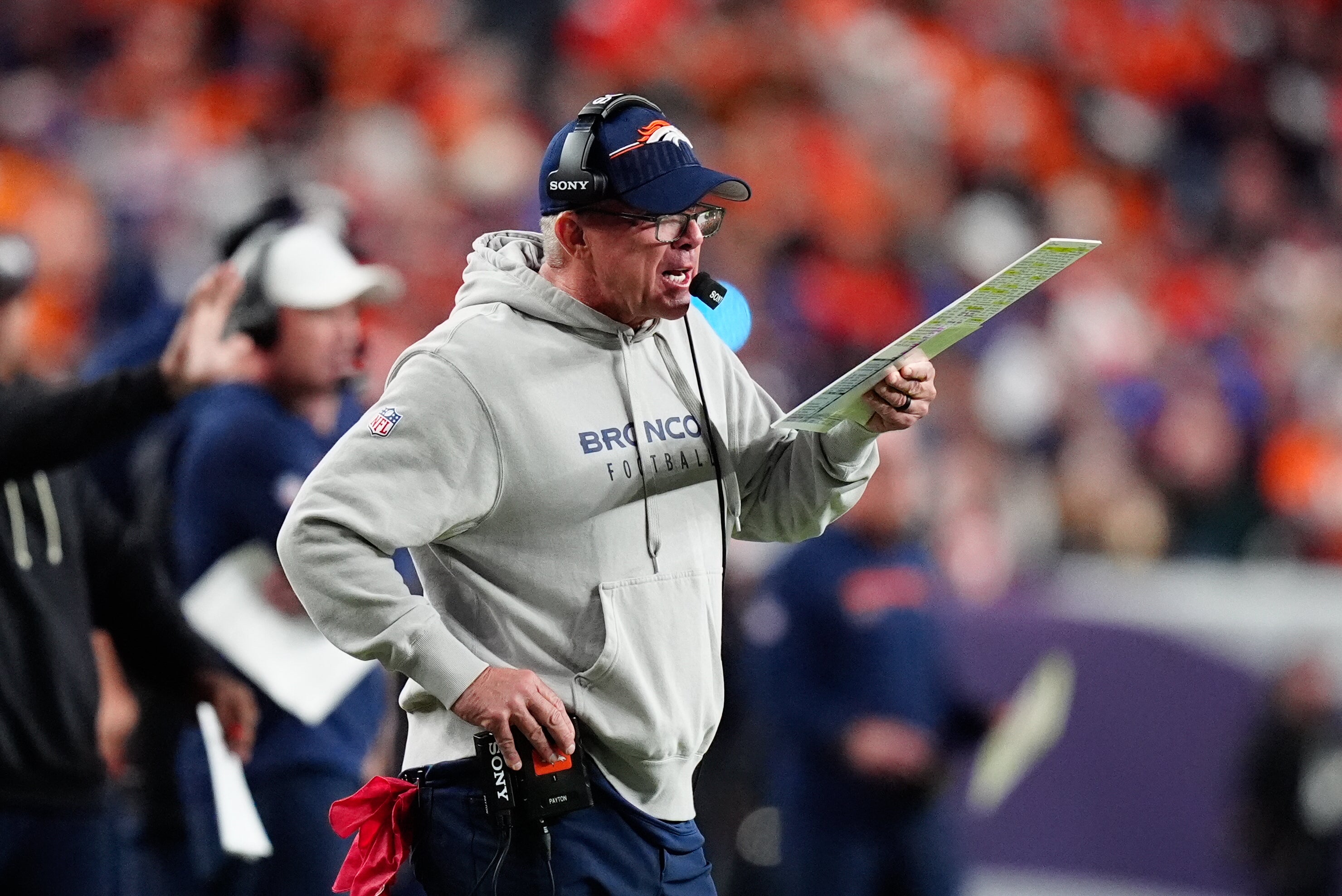 Sep 29, 2025; Denver, Colorado, USA; Denver Broncos head coach Sean Payton calls a play from the sideline during the second quarter against the Cincinnati Bengals at Empower Field at Mile High.