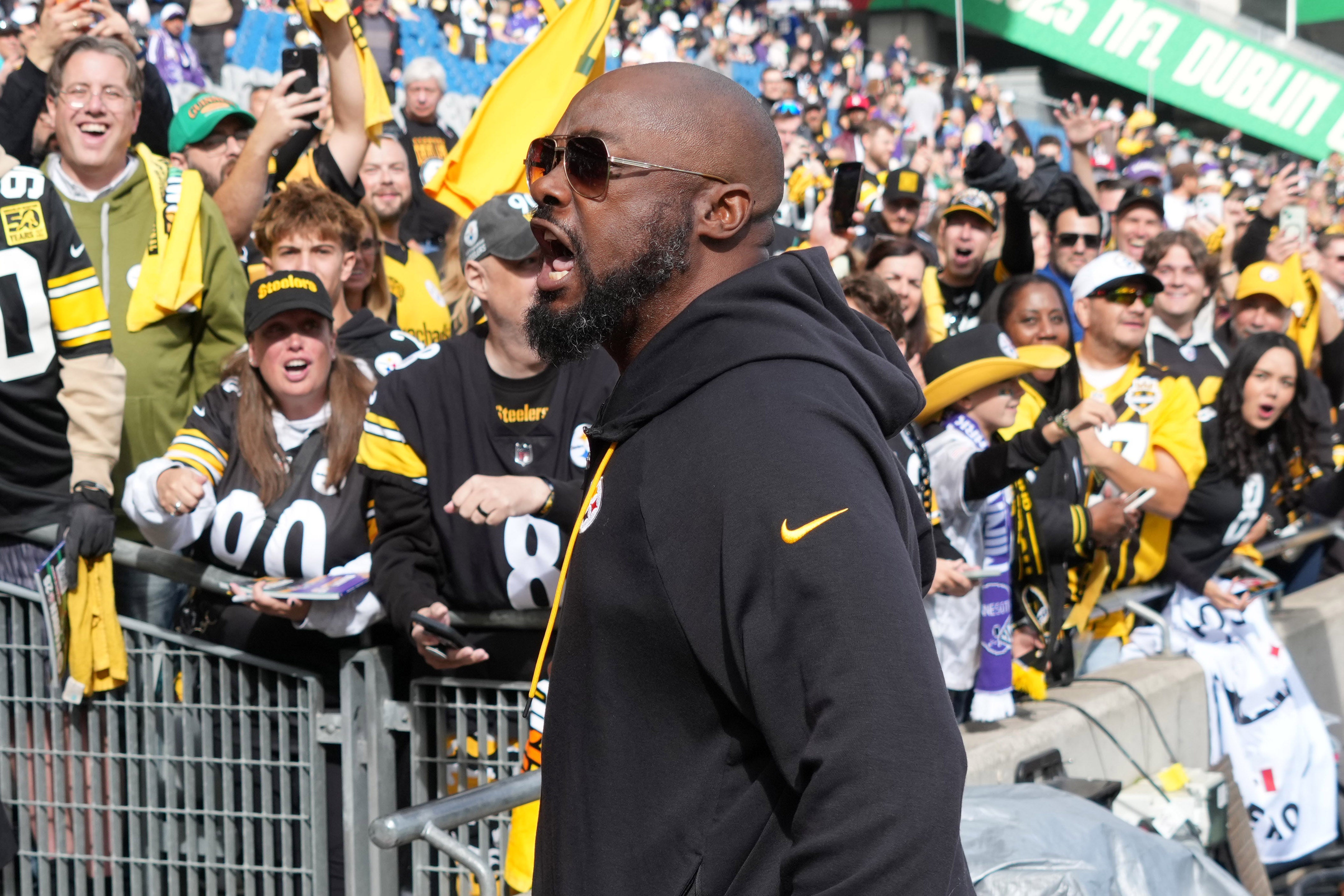 Sep 28, 2025; Dublin, Ireland; Pittsburgh Steelers coach Mike Tomlin interacts with fans during an NFL International Series game against the Minnesota Vikings at Croke Park.