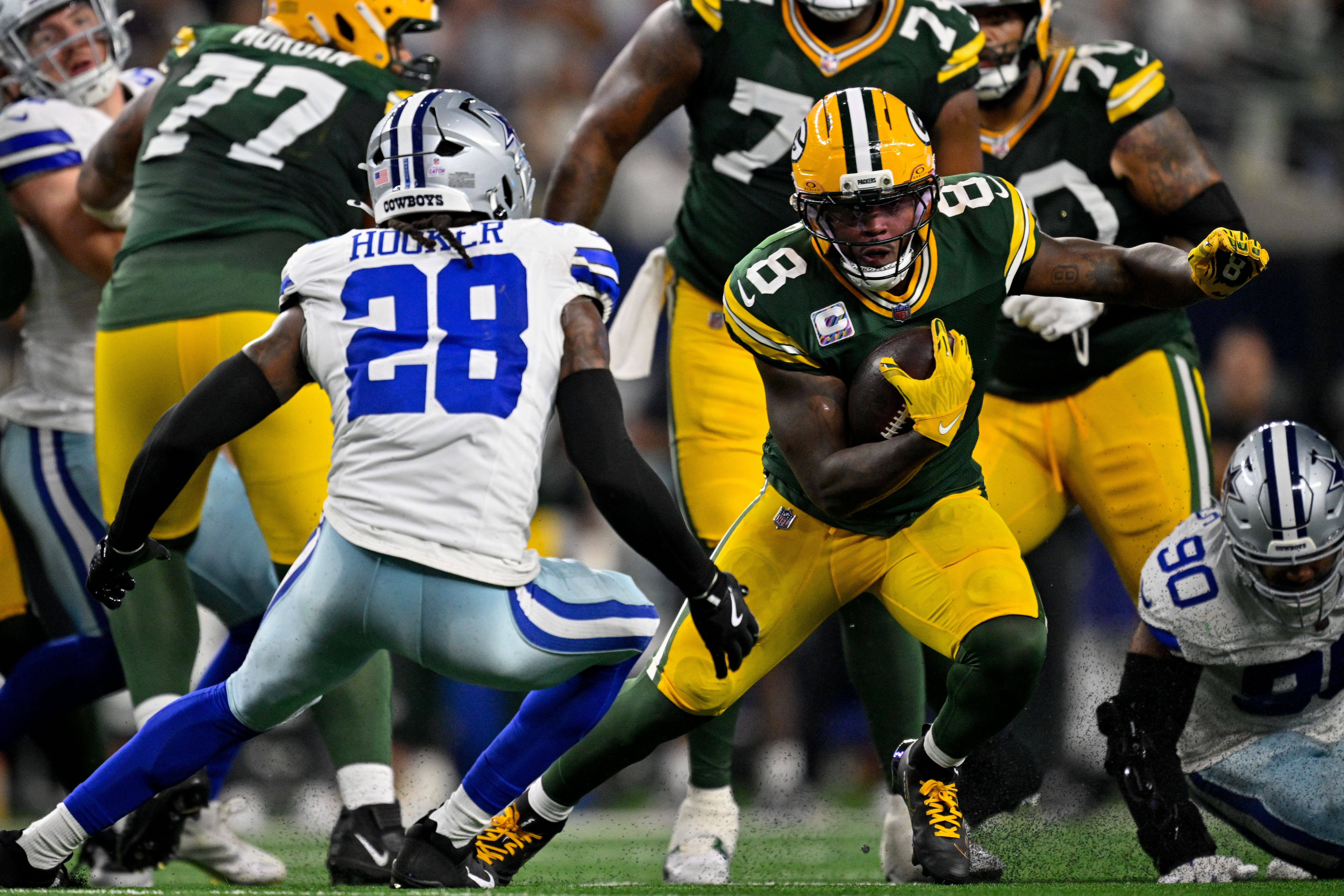 Sep 28, 2025; Arlington, Texas, USA; Green Bay Packers running back Josh Jacobs (8) runs with the ball during the game between the Dallas Cowboys and the Green Bay Packers at AT&T Stadium.