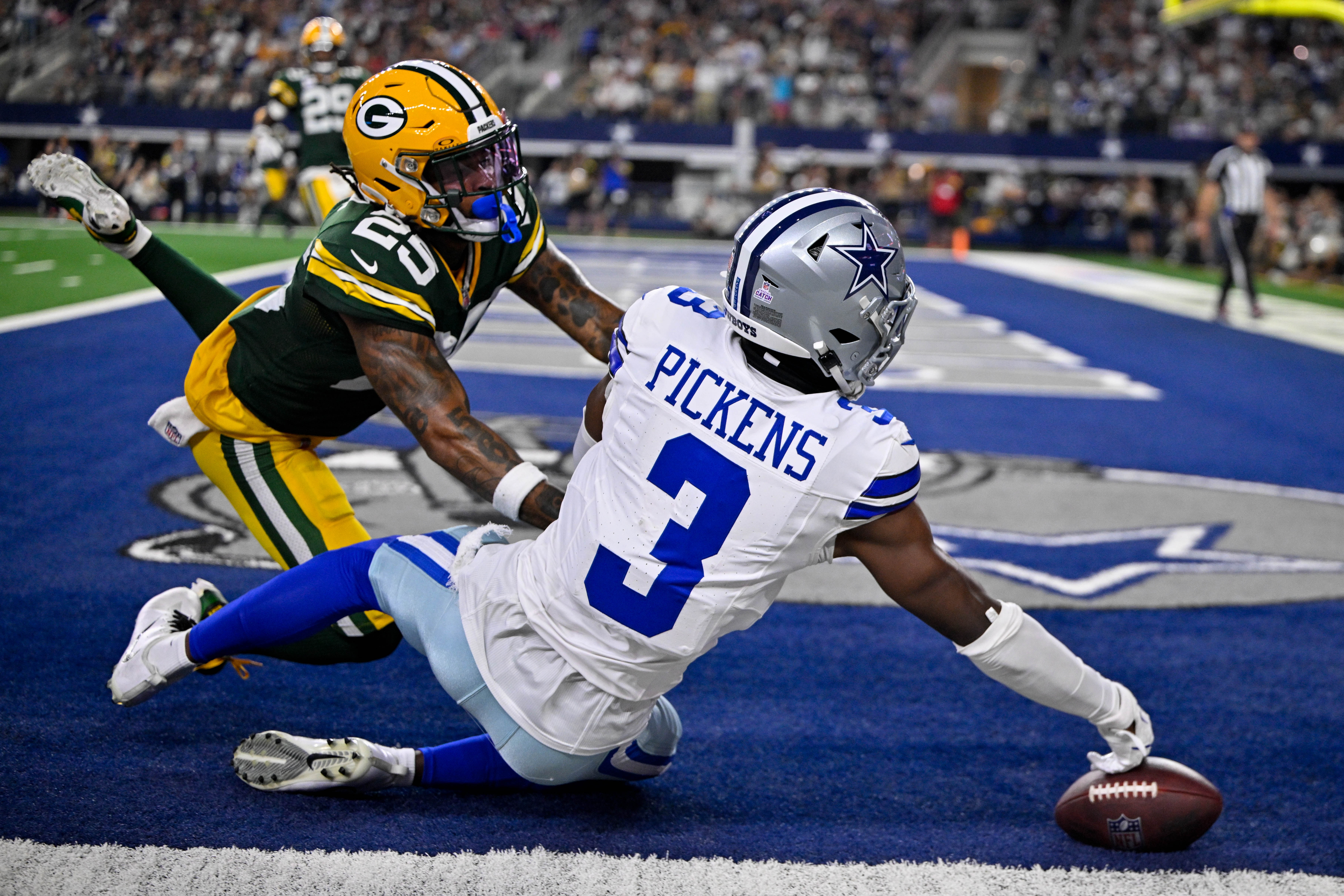 Sep 28, 2025; Arlington, Texas, USA; Green Bay Packers cornerback Keisean Nixon (25) breaks up a pass intended for Dallas Cowboys wide receiver George Pickens (3) during the game between the Dallas Cowboys and the Green Bay Packers at AT&T Stadium.