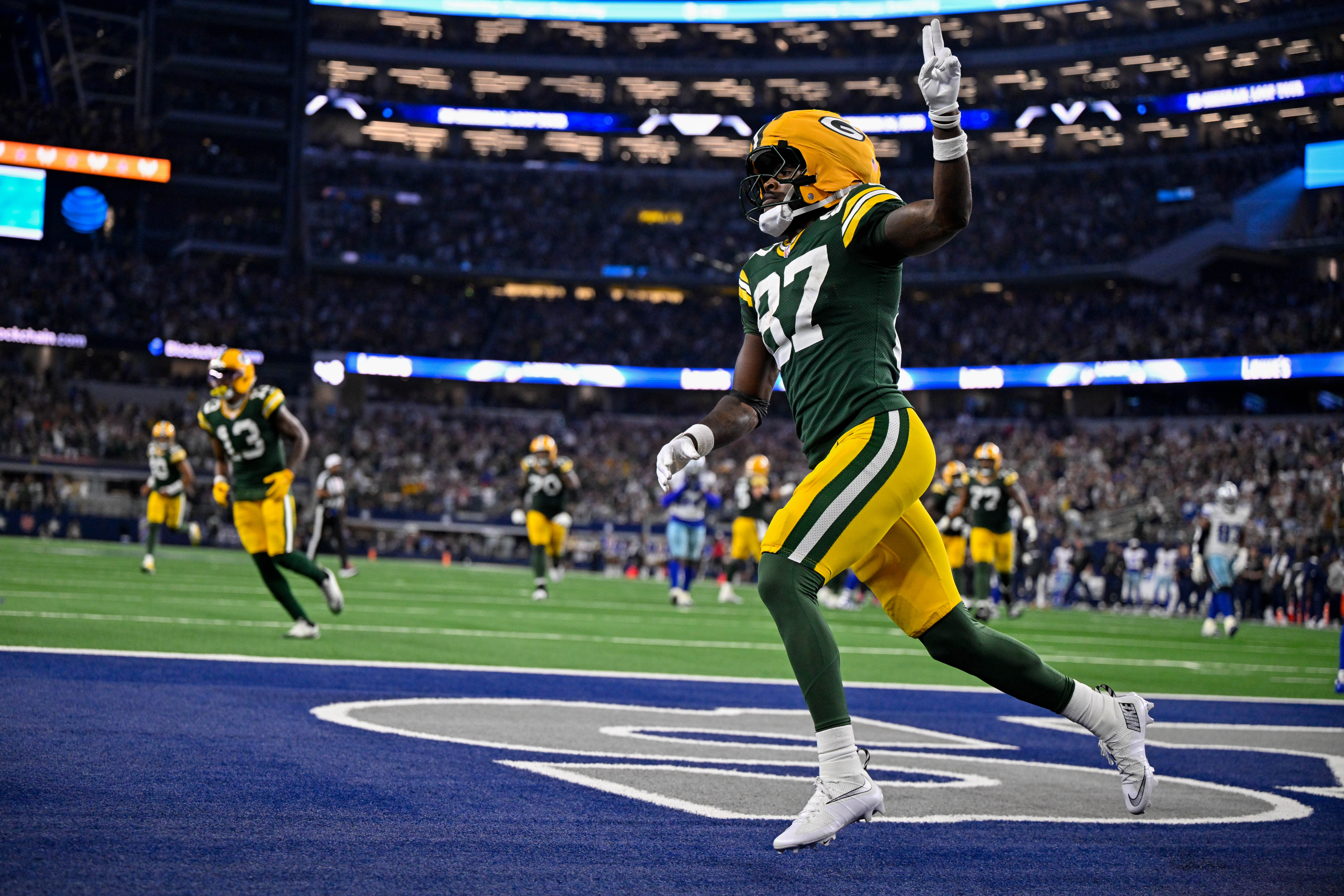 Sep 28, 2025; Arlington, Texas, USA; Green Bay Packers wide receiver Romeo Doubs (87) celebrates in the end zone after he catches a pass for a touchdown during the game between the Dallas Cowboys and the Green Bay Packers at AT&T Stadium.