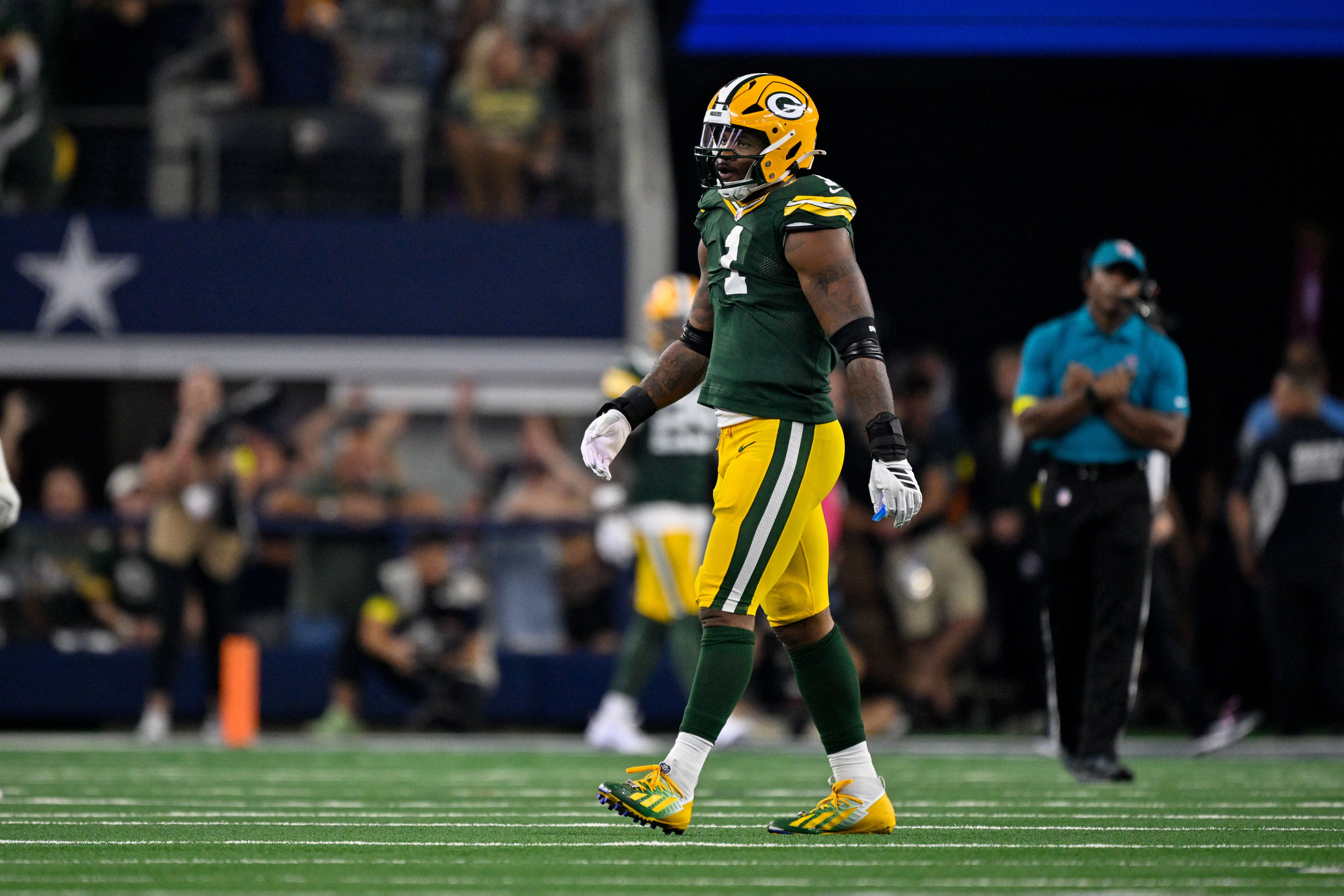 Sep 28, 2025; Arlington, Texas, USA; Green Bay Packers defensive end Micah Parsons (1) walks off the field after the Dallas Cowboys score the go ahead touchdown during the game at AT&T Stadium.