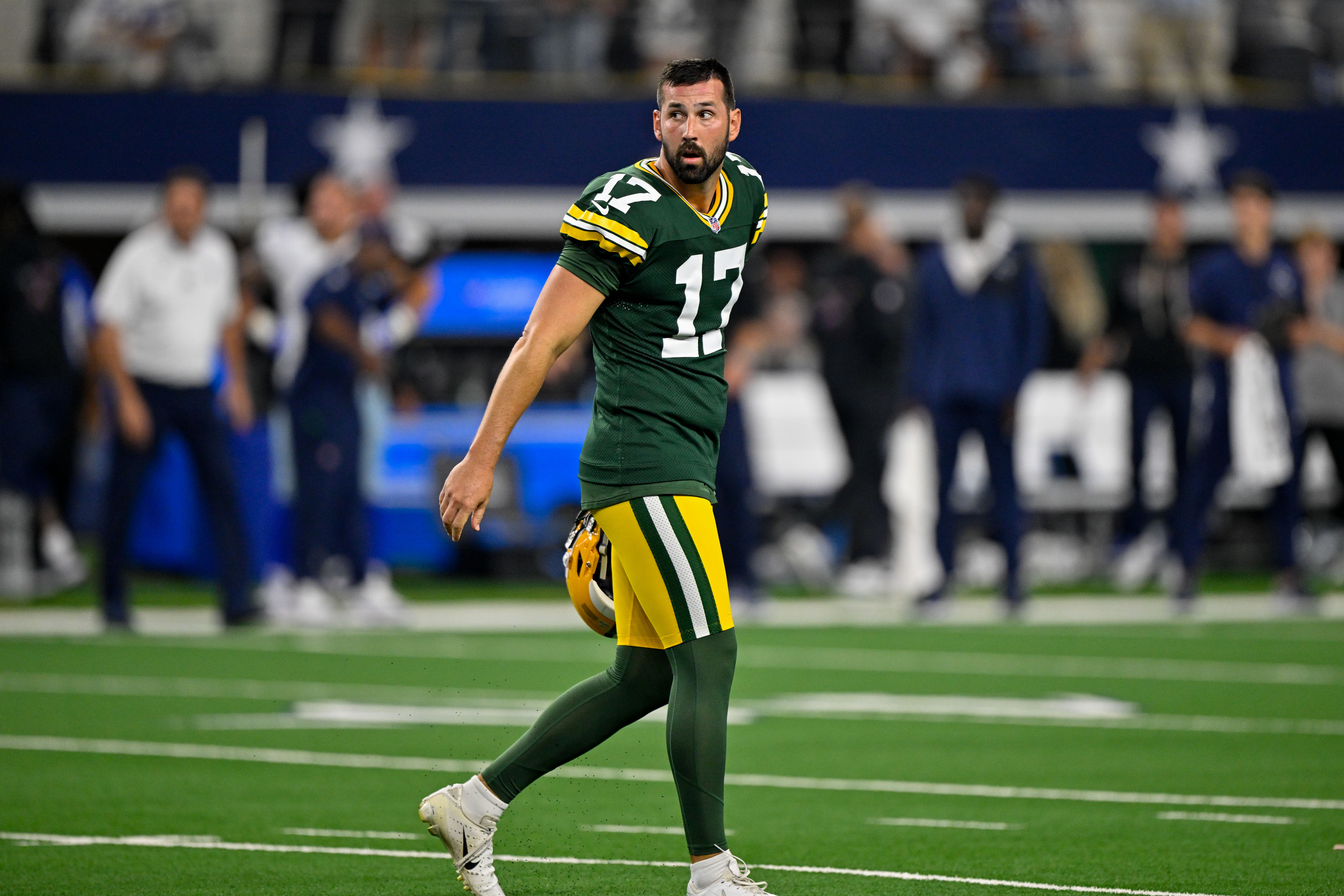 Sep 28, 2025; Arlington, Texas, USA; Green Bay Packers place kicker Brandon McManus (17) walks off the field after he kicks the game tying field goal in overtime during the game between the Dallas Cowboys and the Green Bay Packers at AT&T Stadium.