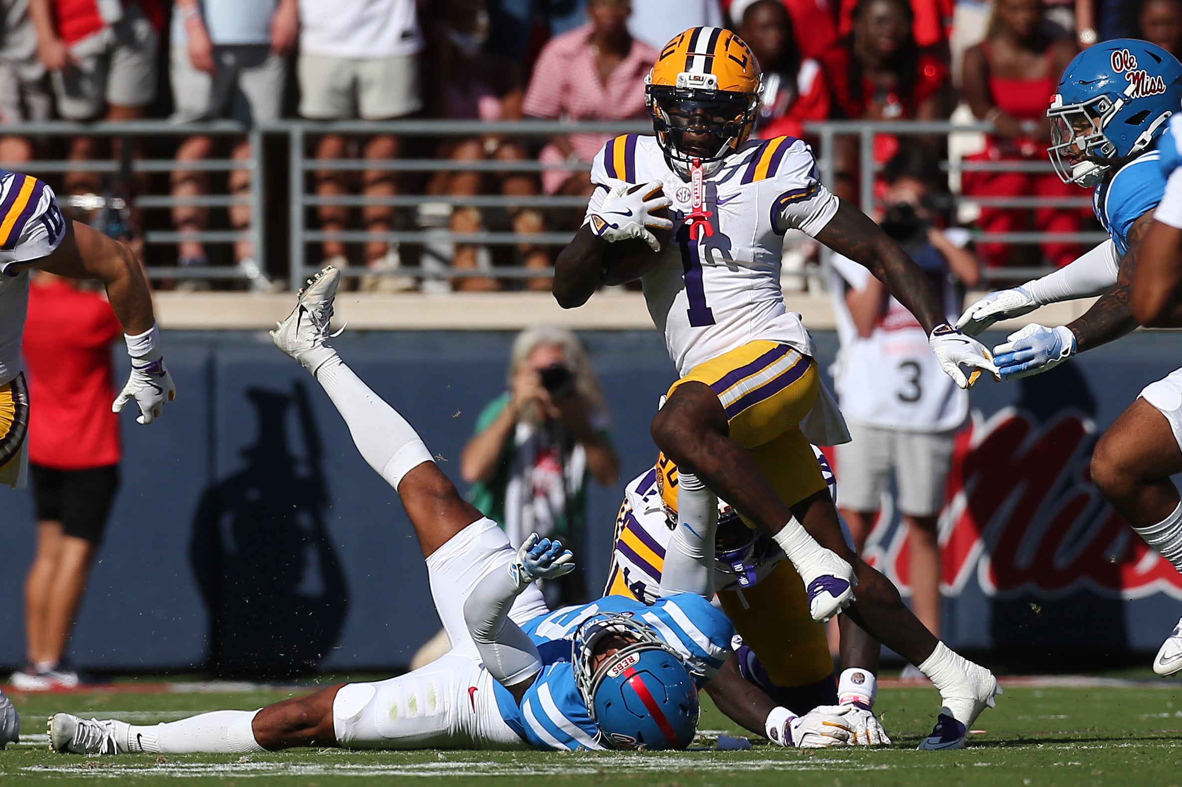 Sep 27, 2025; Oxford, Mississippi, USA; LSU Tigers wide receiver Aaron Anderson (1) runs after a catch during the second quarter against the Mississippi Rebels at Vaught-Hemingway Stadium. Mandatory Credit: Petre Thomas-Imagn Images