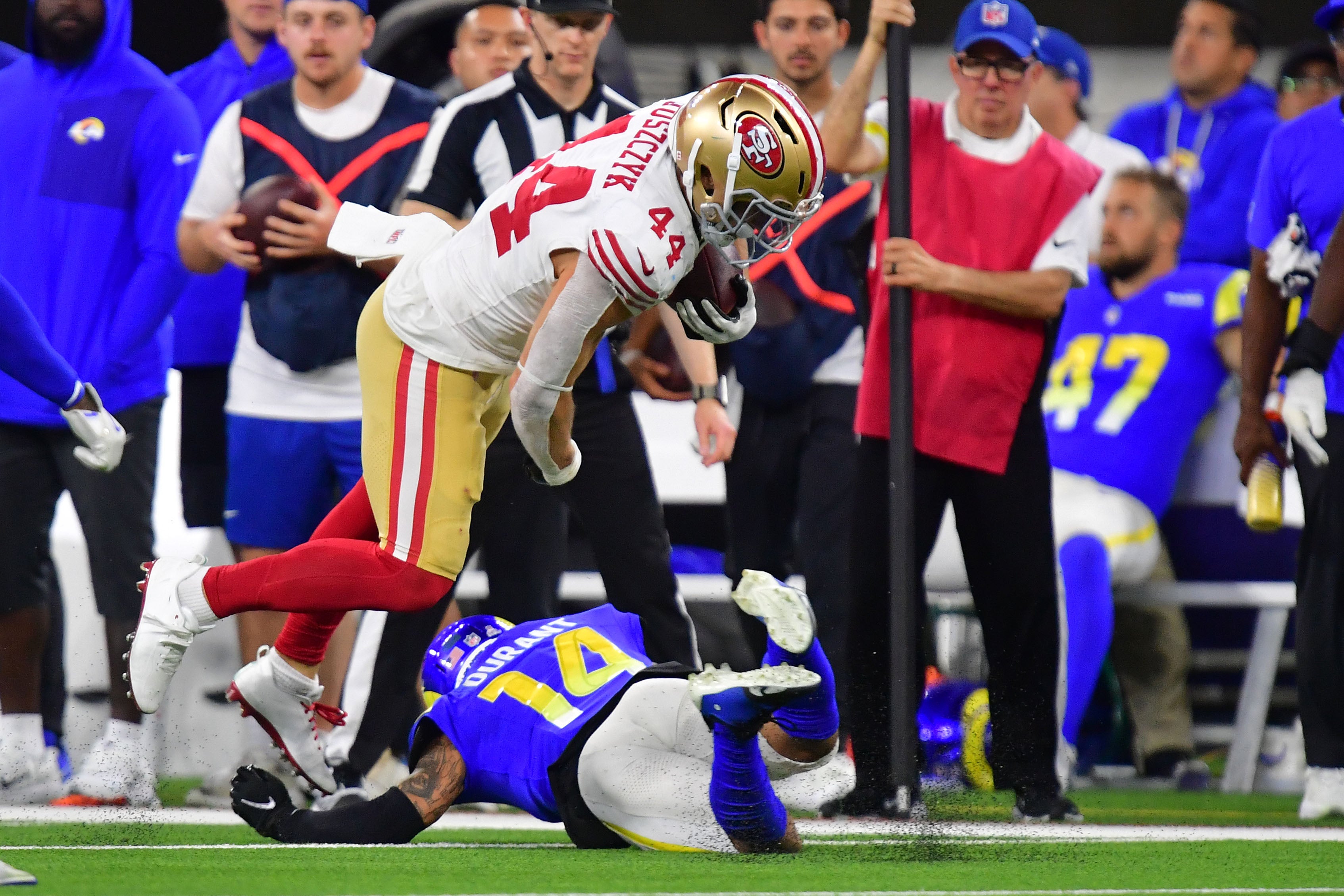 Oct 2, 2025; Inglewood, California, USA; San Francisco 49ers fullback Kyle Juszczyk (44) makes a catch over Los Angeles Rams cornerback Cobie Durant (14) during the second half at SoFi Stadium.