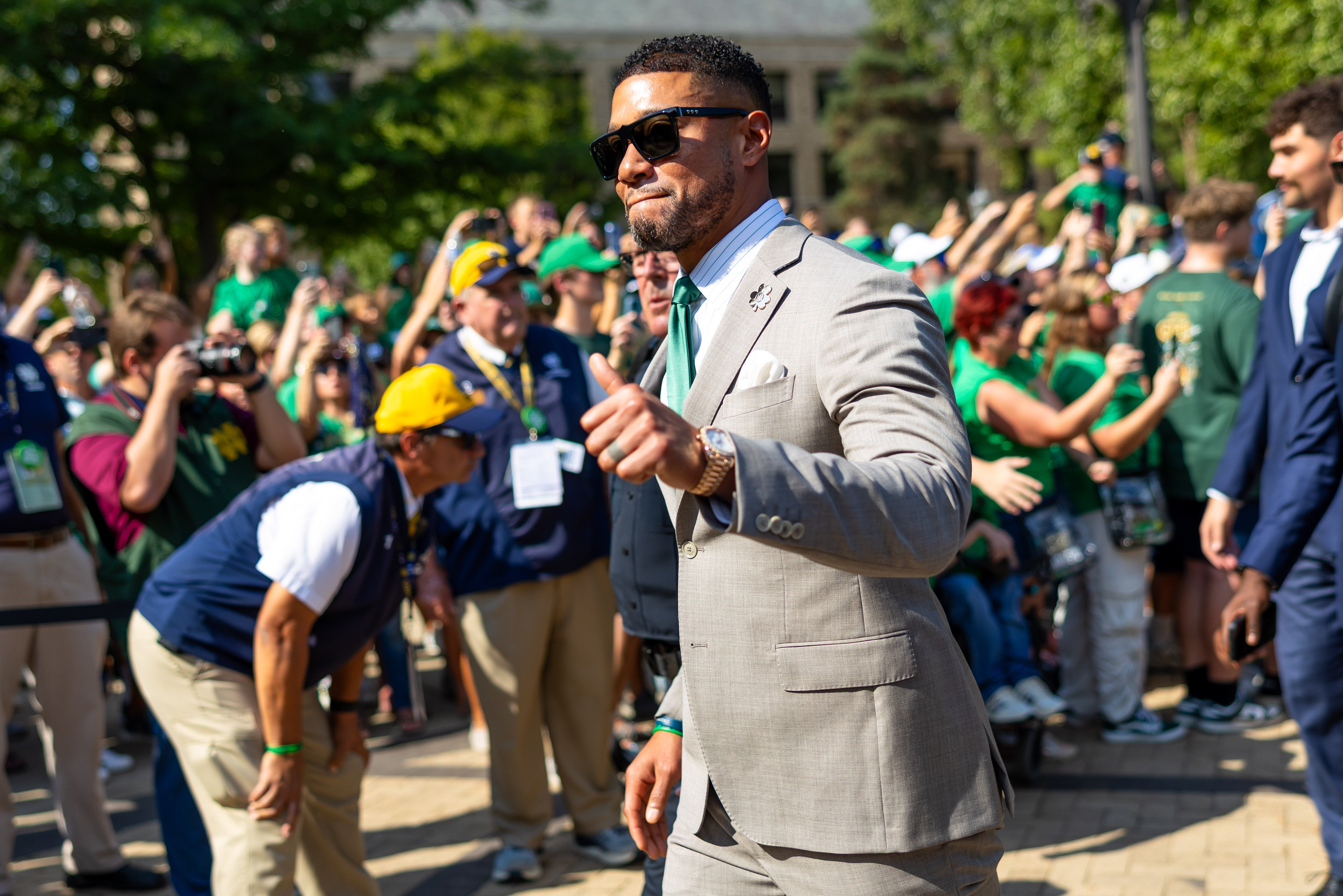 Oct 4, 2025; South Bend, Indiana, USA; Notre Dame Fighting Irish head coach Marcus Freeman gives a thumbs up to fans while walking to the stadium before a game against the Boise State Broncos at Notre Dame Stadium. Mandatory Credit: Michael Caterina-Imagn Images