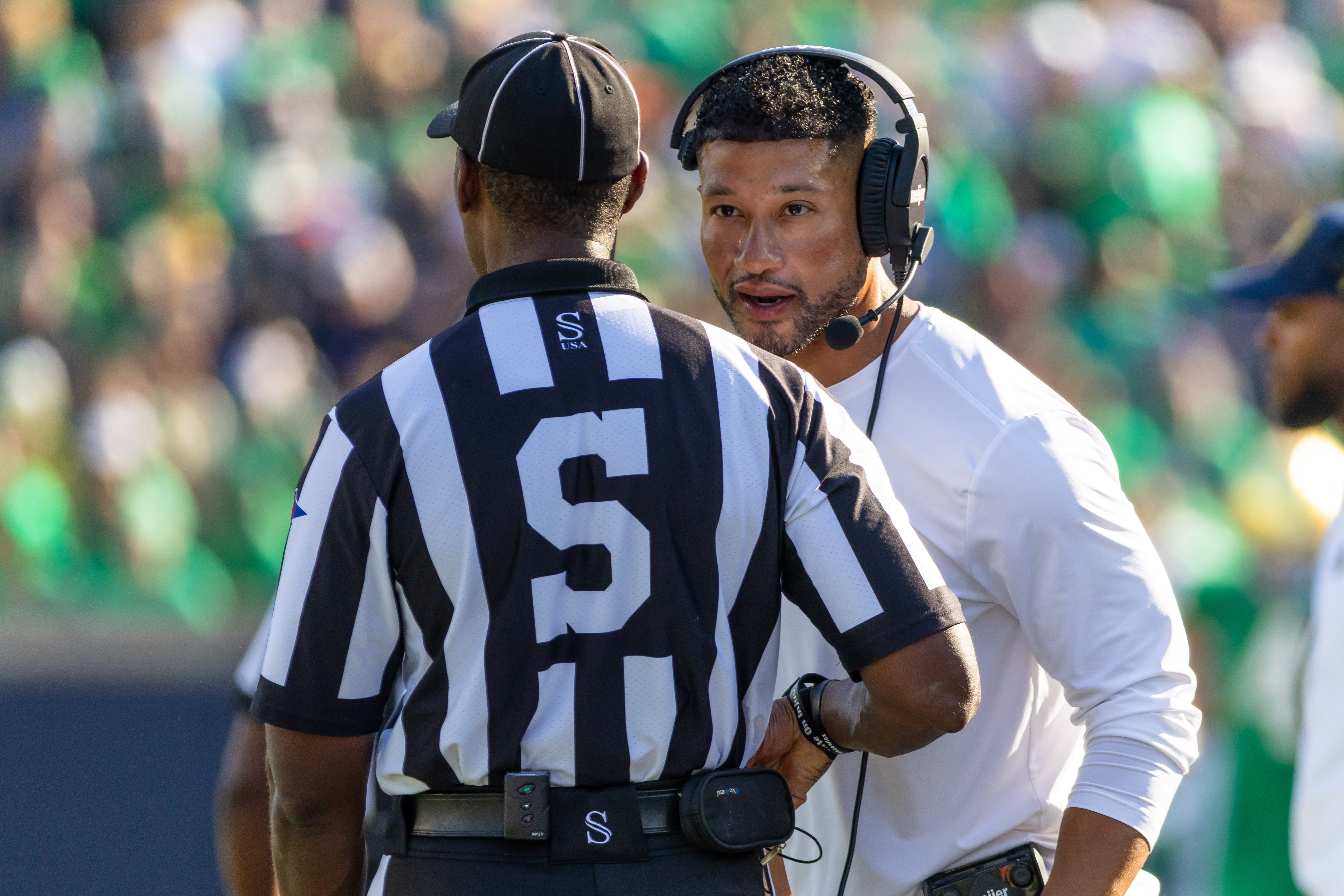 Oct 4, 2025; South Bend, Indiana, USA; Notre Dame Fighting Irish head coach Marcus Freeman talks to an official during the first half at Notre Dame Stadium. Mandatory Credit: Michael Caterina-Imagn Images