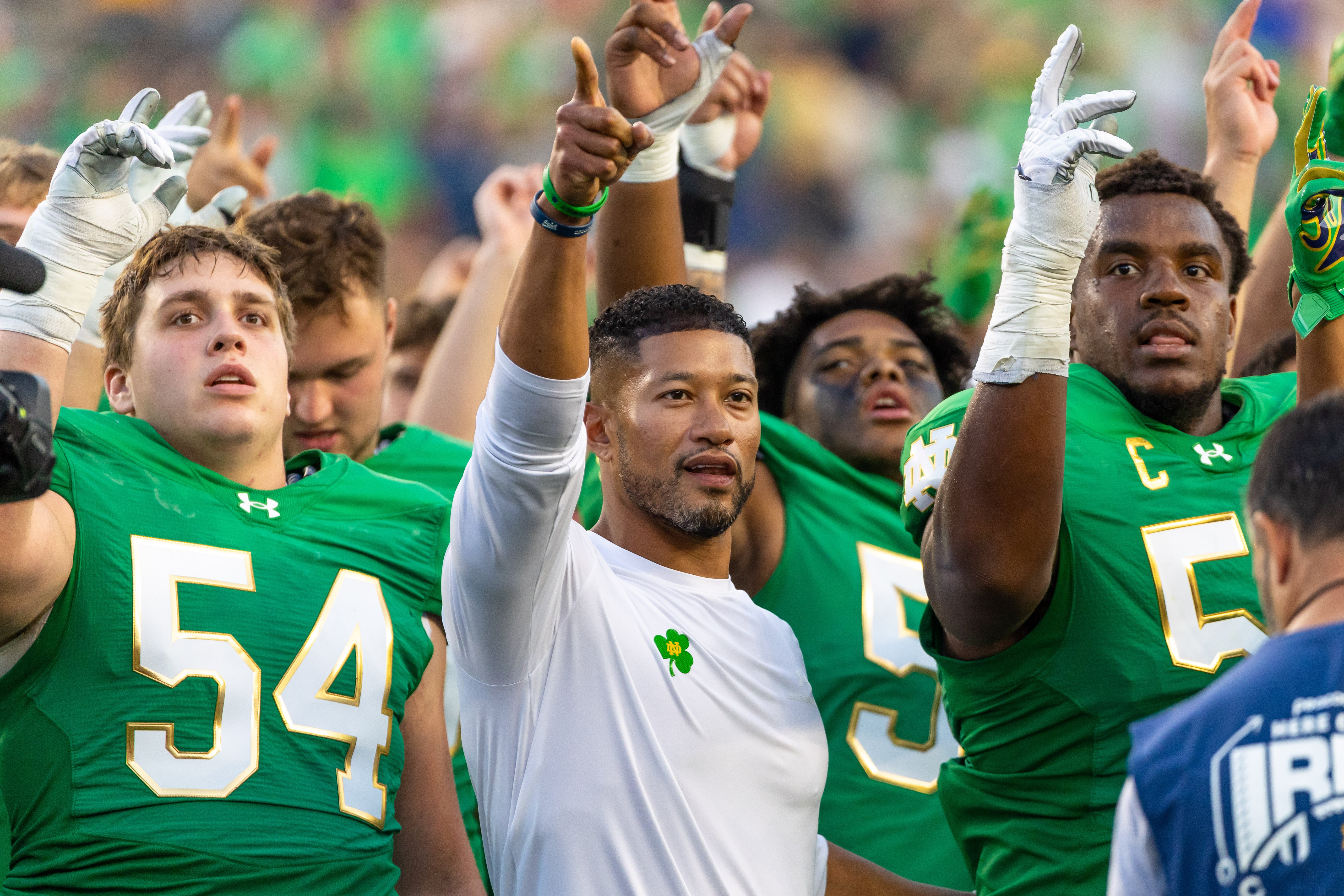 Oct 4, 2025; South Bend, Indiana, USA; Notre Dame Fighting Irish head coach Marcus Freeman sings the Alma Mater after beating the Boise State Broncos at Notre Dame Stadium. Mandatory Credit: Michael Caterina-Imagn Images