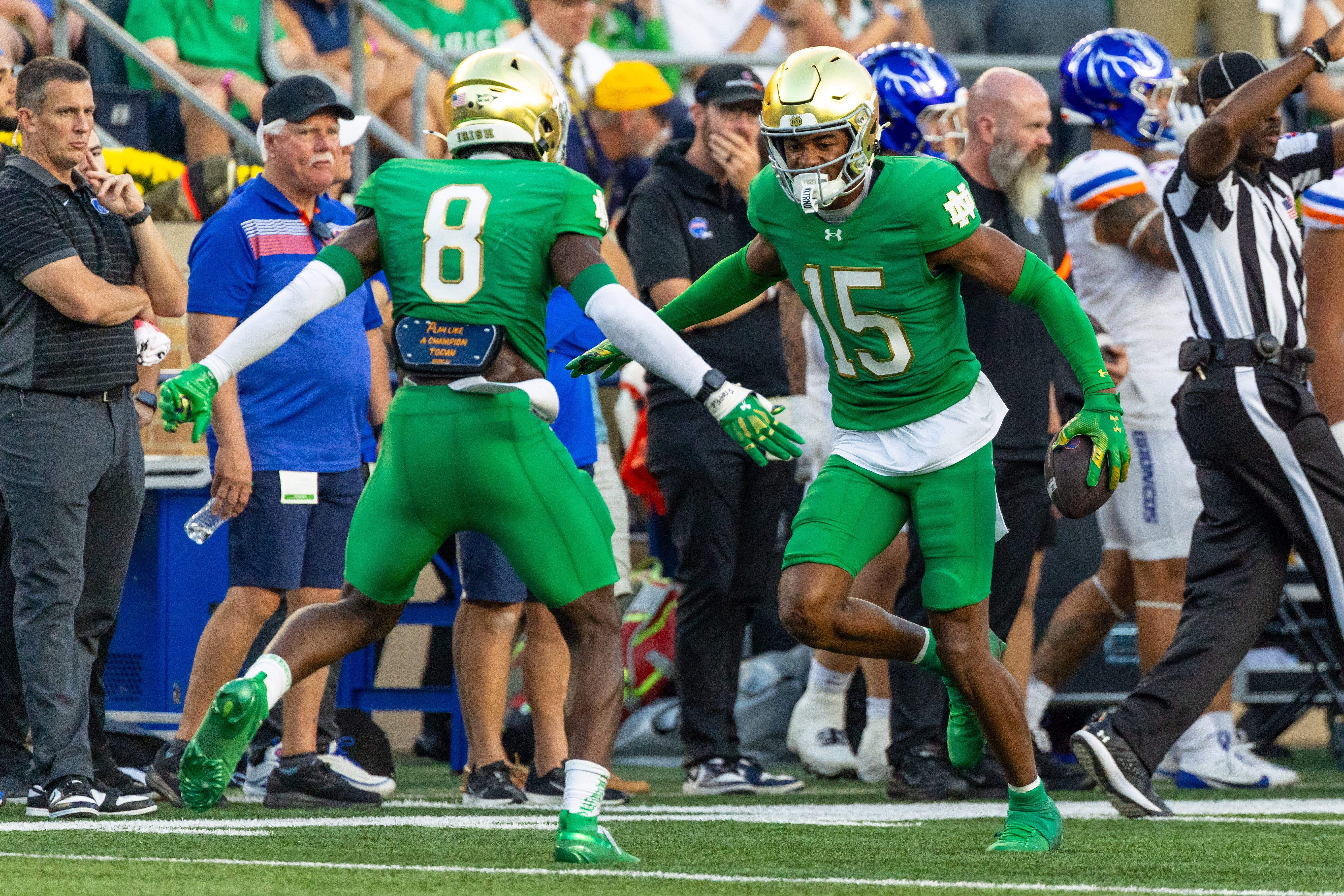 Oct 4, 2025; South Bend, Indiana, USA; Notre Dame Fighting Irish cornerback Leonard Moore (15) celebrates with Notre Dame Fighting Irish safety Adon Shuler (8) during the second half at Notre Dame Stadium. Mandatory Credit: Michael Caterina-Imagn Images