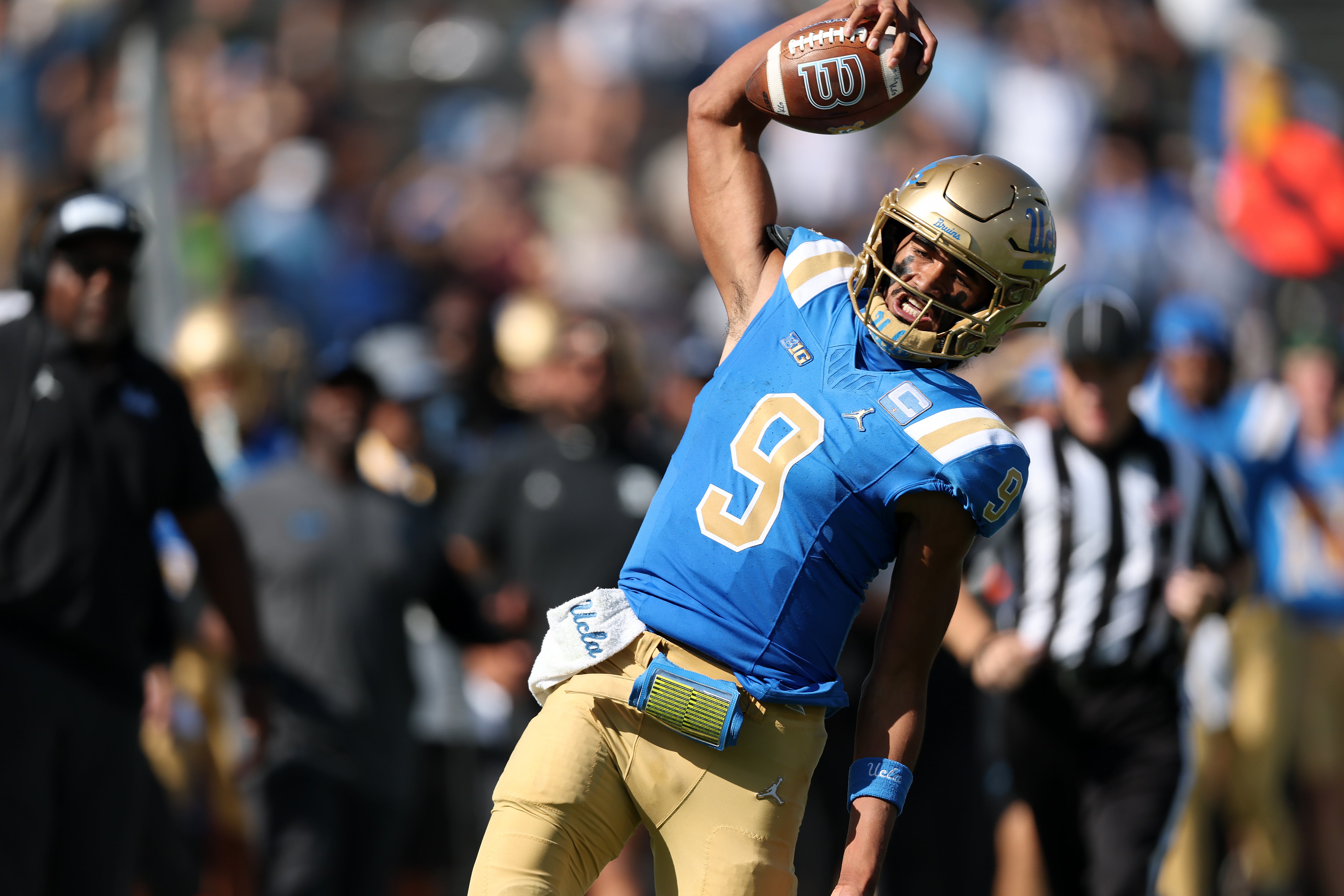 Oct 4, 2025; Pasadena, California, USA; UCLA Bruins quarterback Nico Iamaleava (9) runs with the ball during the third quarter against the Penn State Nittany Lions at Rose Bowl. Mandatory Credit: Kiyoshi Mio-Imagn Images