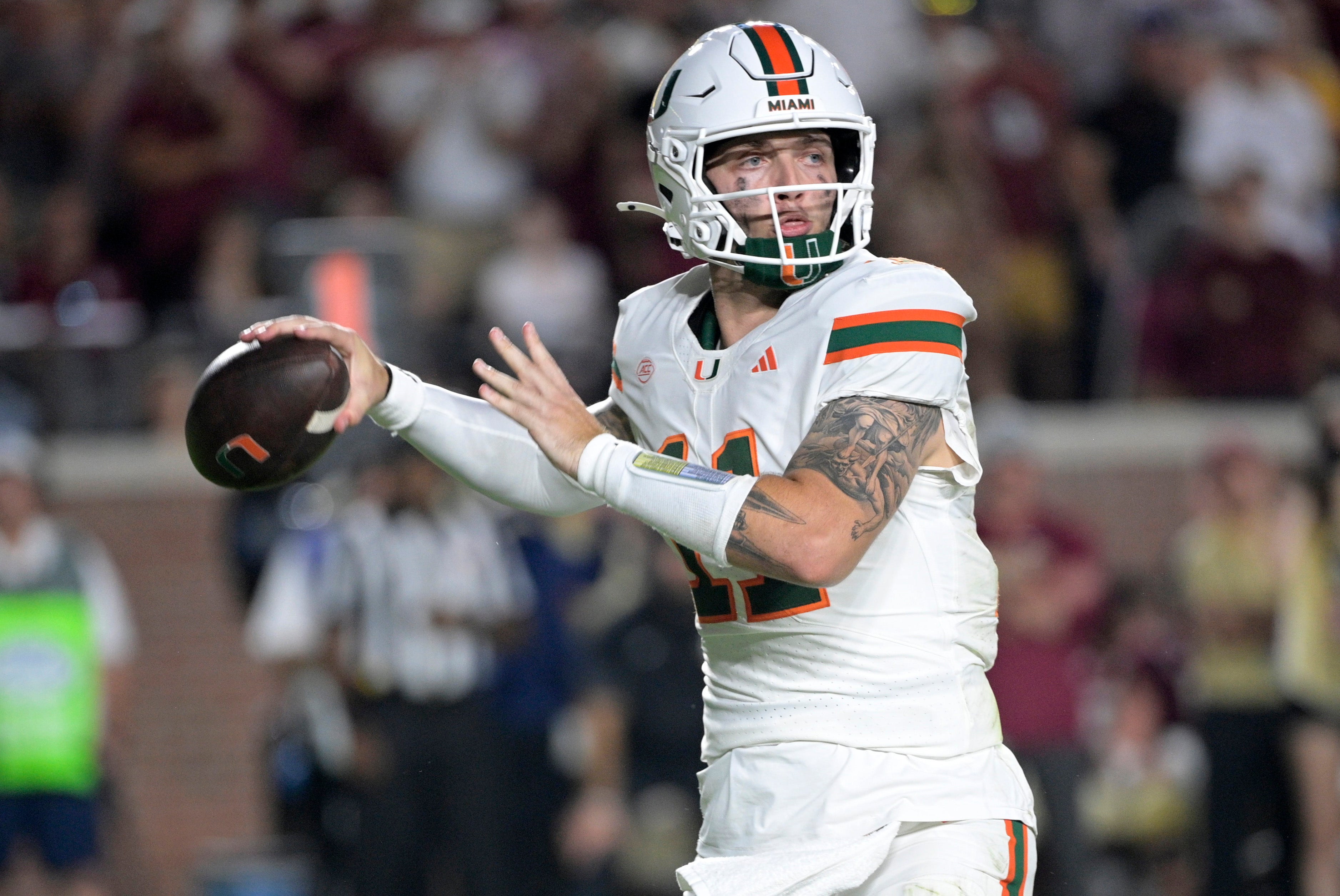 Oct 4, 2025; Tallahassee, Florida, USA; Miami Hurricanes quarterback Carson Beck (11) throws during the second half against the Florida State Seminoles at Doak S. Campbell Stadium.