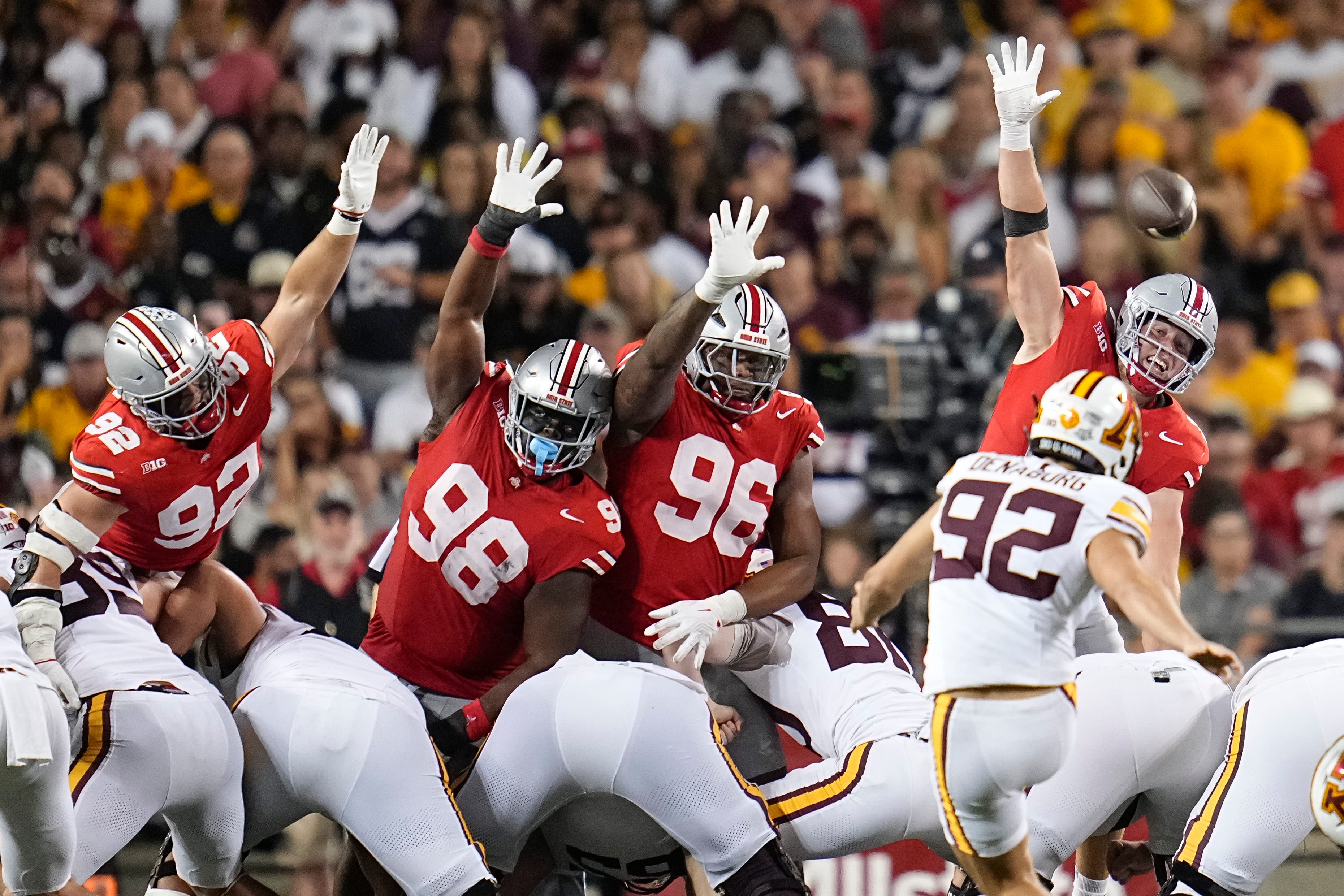 Ohio State Buckeyes defensive end Caden Curry (92), defensive lineman Kayden McDonald (98), defensive end Eddrick Houston (96) and defensive lineman Beau Atkinson (14) try to block a missed field goal attempt by Minnesota Golden Gophers kicker Brady Denaburg (92) during the second half of the NCAA football game at Ohio Stadium in Columbus on Oct. 4, 2025. Ohio State won 42-3.