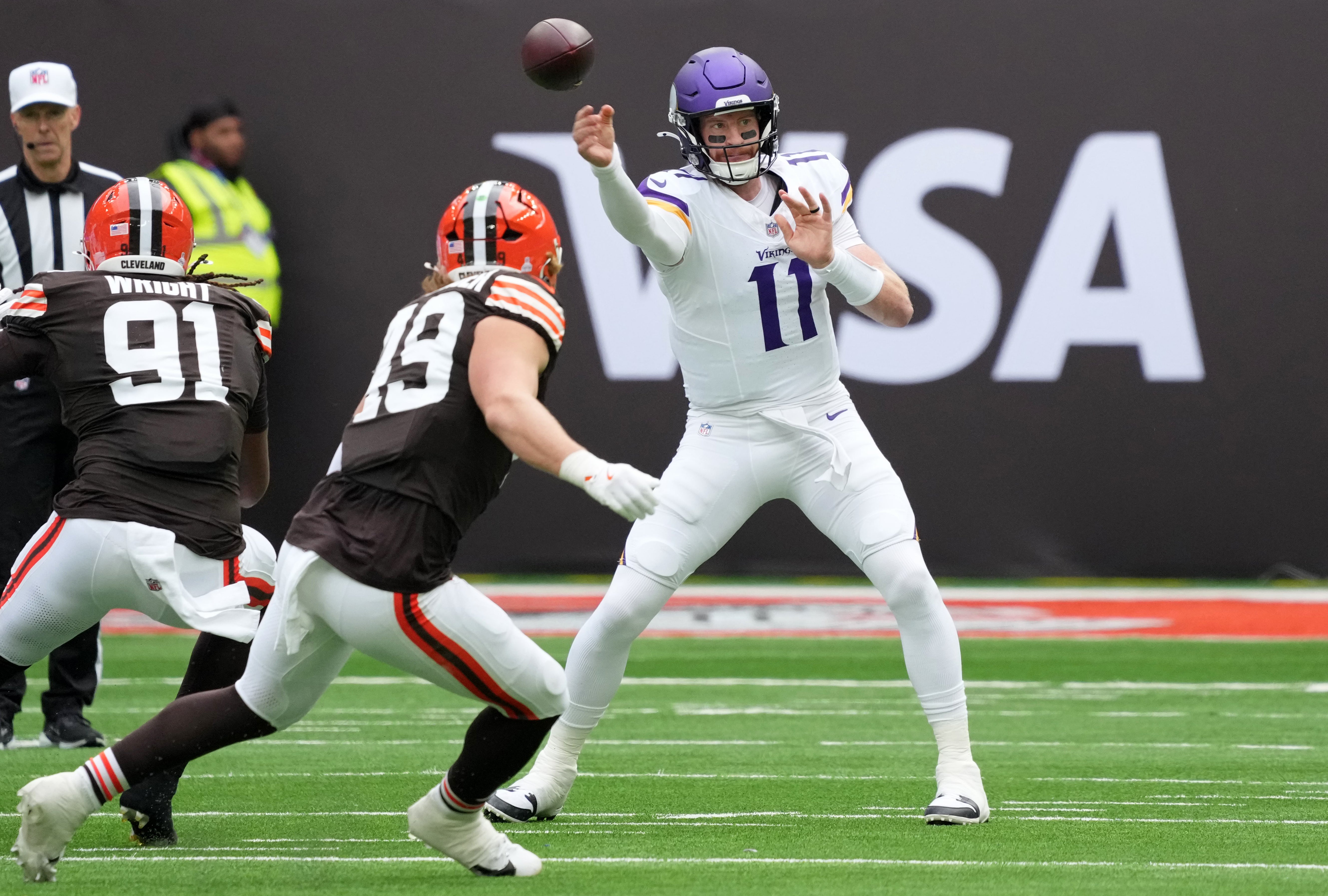 Oct 5, 2025; Tottenham, United Kingdom; Minnesota Vikings quarterback Carson Wentz (11) passes the ball against the Cleveland Browns during the first quarter of an NFL International Series game at Tottenham Hotspur Stadium.