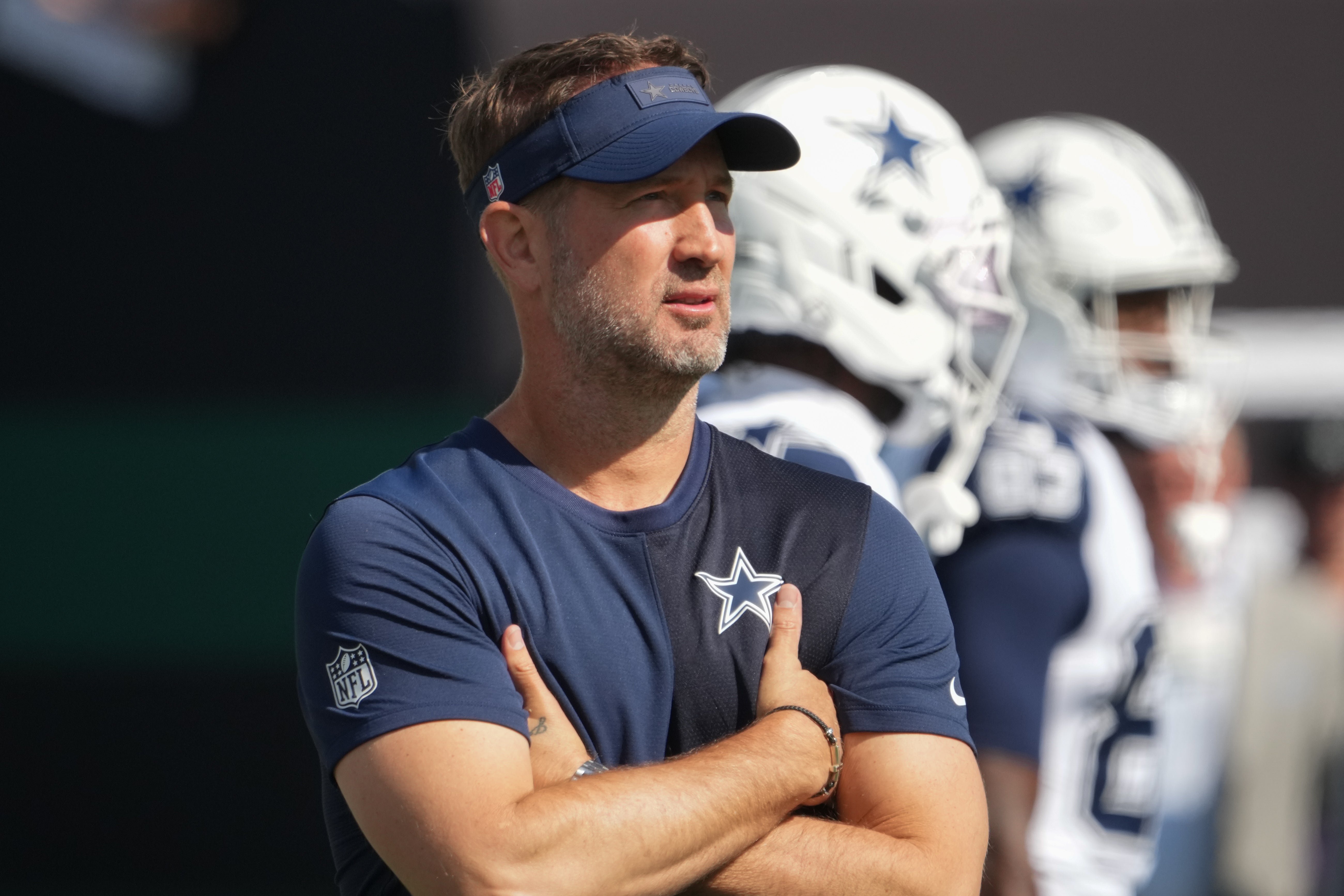 Oct 5, 2025; East Rutherford, New Jersey, USA; Dallas Cowboys head coach Brian Schottenheimer stands on the field during warm ups prior to a game against the New York Jets at MetLife Stadium.