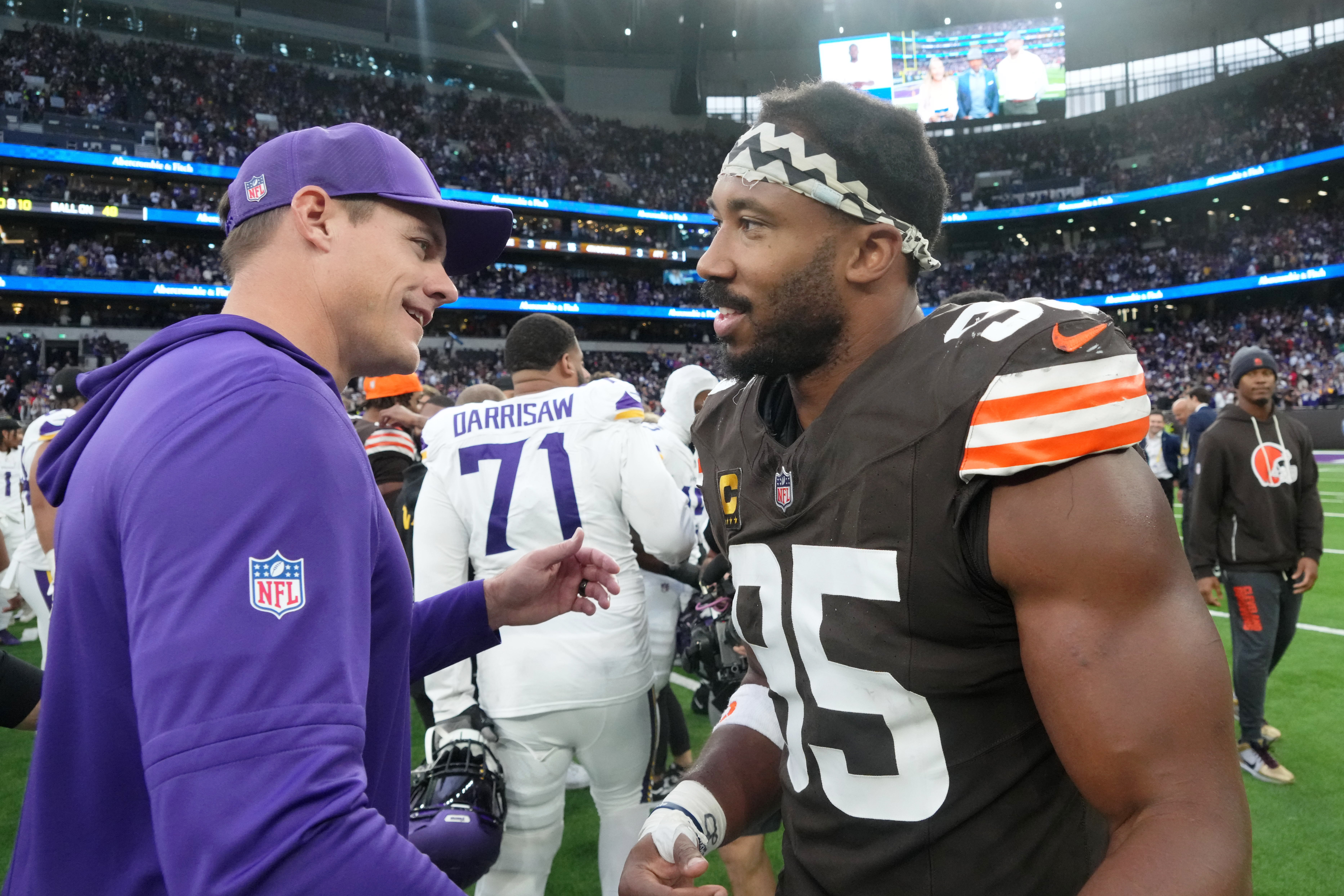 Oct 5, 2025; Tottenham, United Kingdom; Minnesota Vikings head coach Kevin O'Connell greets Cleveland Browns defensive end Myles Garrett (95) after an NFL International Series game at Tottenham Hotspur Stadium.