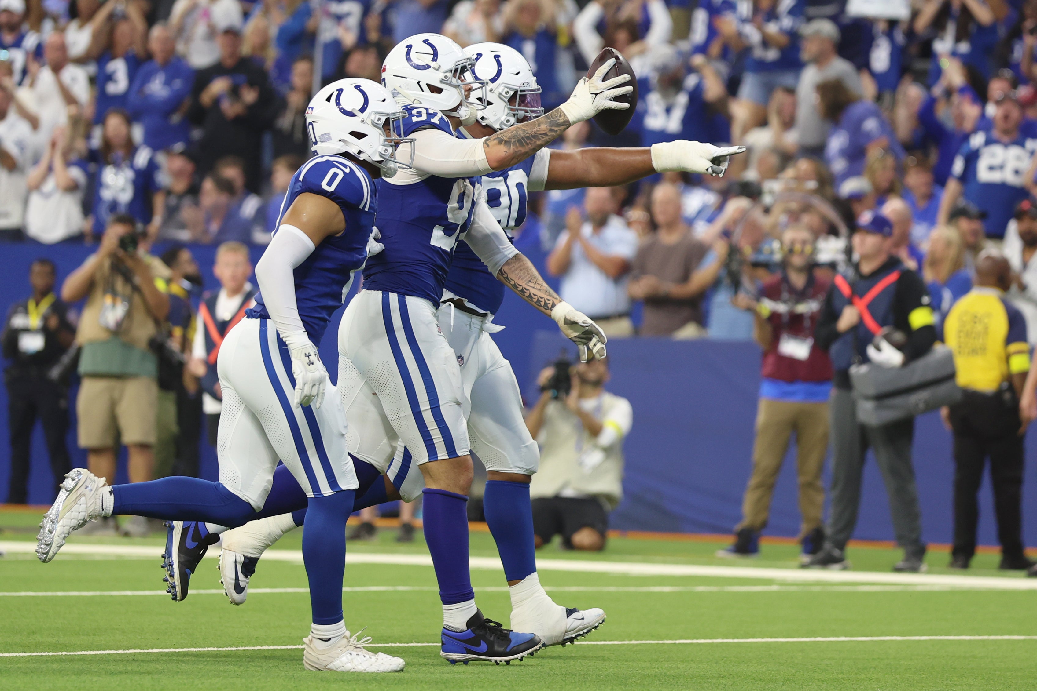 Colts defense celebrates a turnover