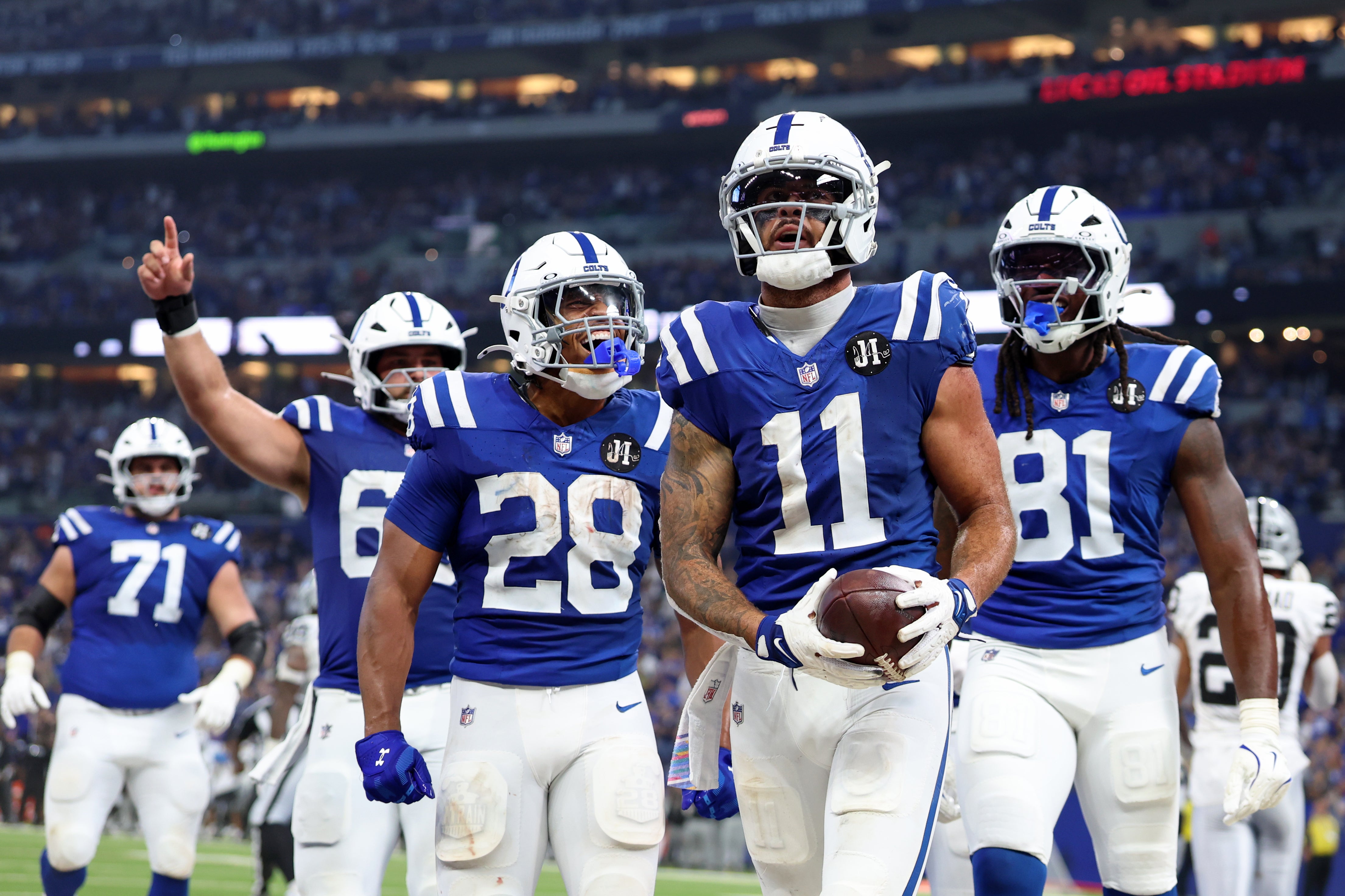 Colts offense celebrates after a touchdown catch by WR Michael Pittman Jr.