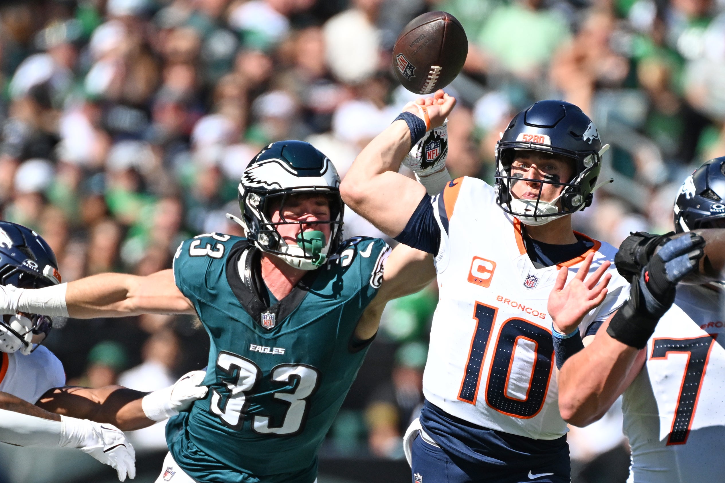 Denver Broncos quarterback Bo Nix (10) is pressured by Philadelphia Eagles cornerback Cooper Dejean (33) during the first quarter at Lincoln Financial Field.