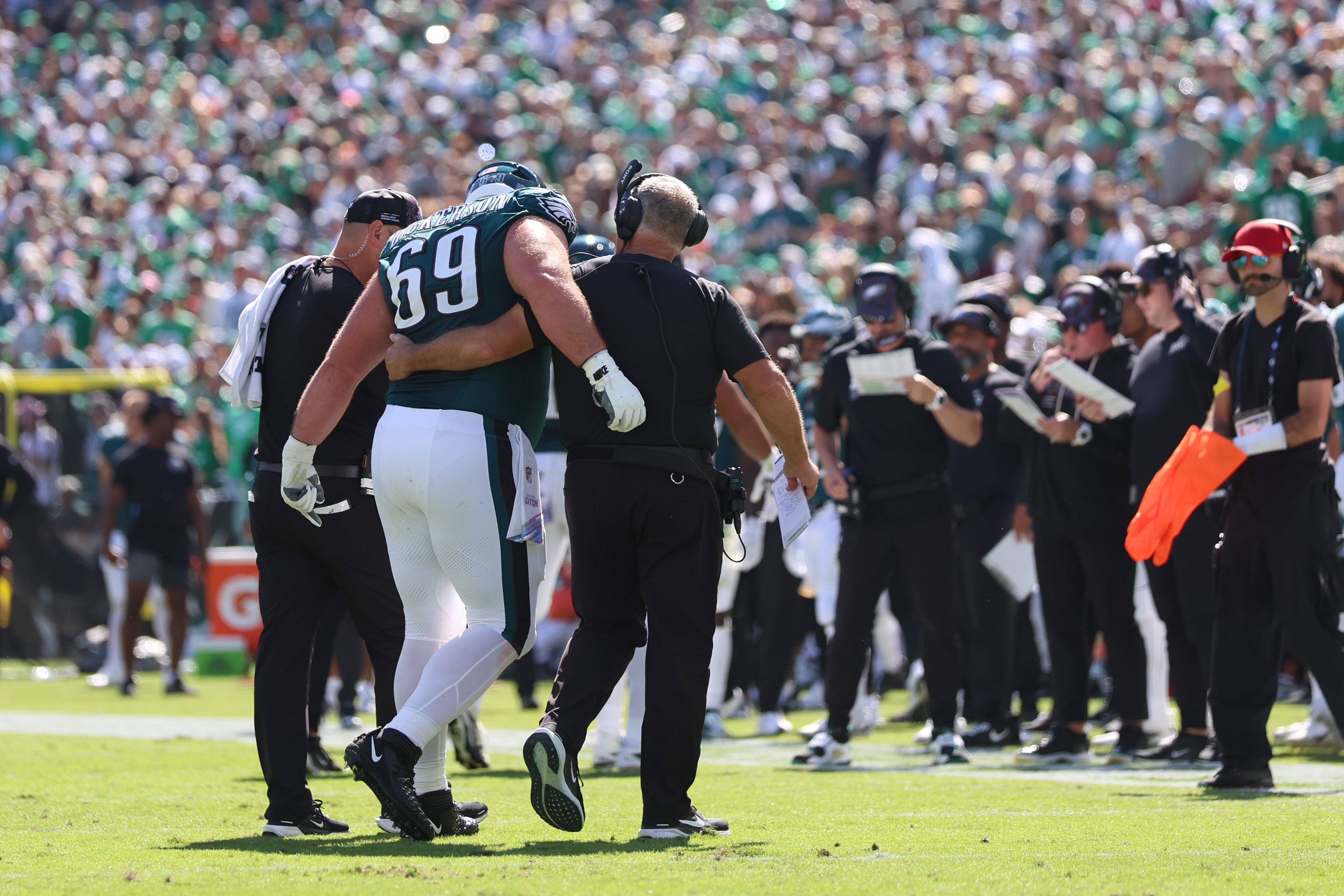 Philadelphia Eagles guard Landon Dickerson (69) is helped off the field in the first quarter against the Denver Broncos at Lincoln Financial Field.