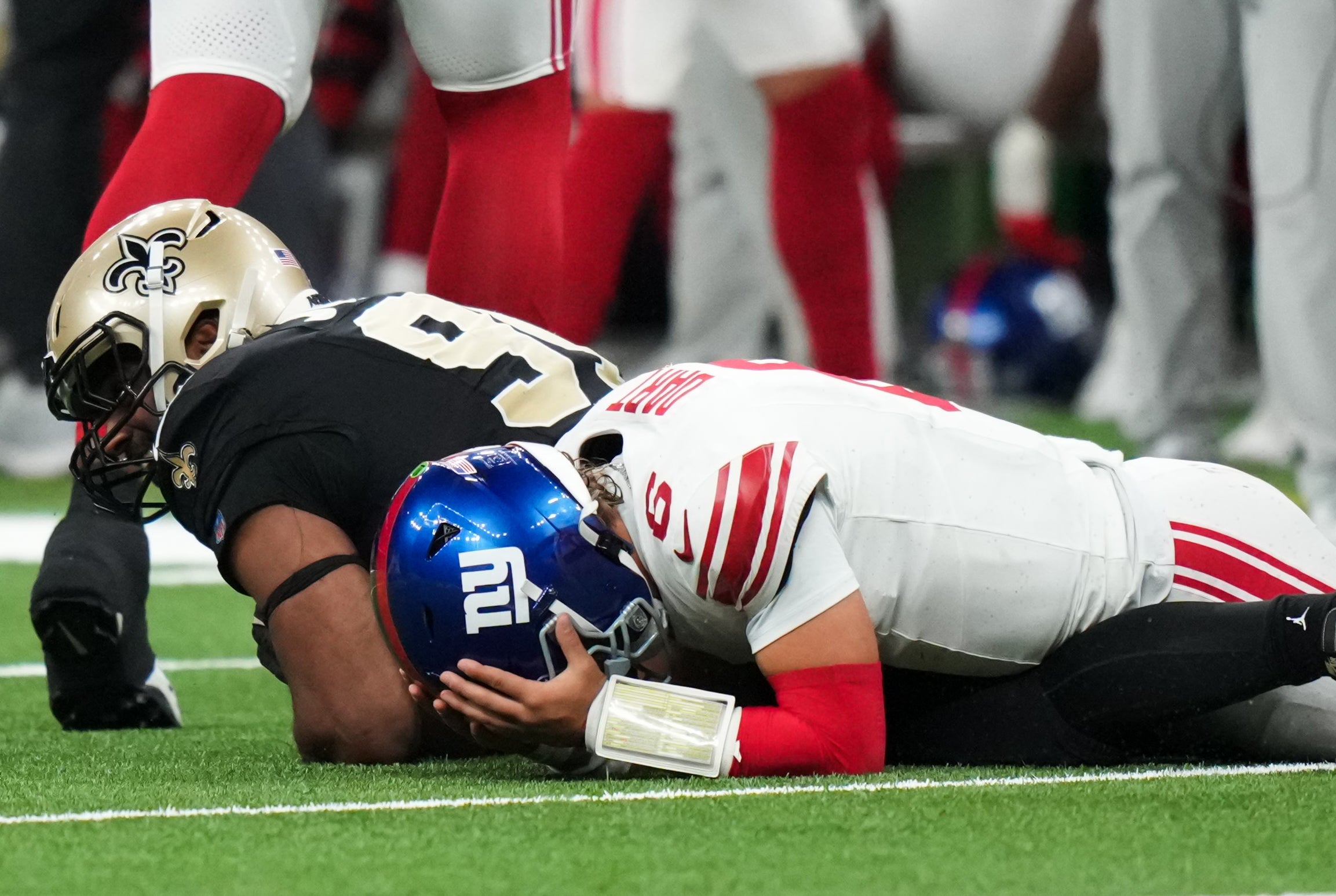 Oct 5, 2025; New Orleans, Louisiana, USA; New York Giants quarterback Jaxson Dart (6) reacts after fumbling the ball against the New Orleans Saints during the third quarter at Caesars Superdome.