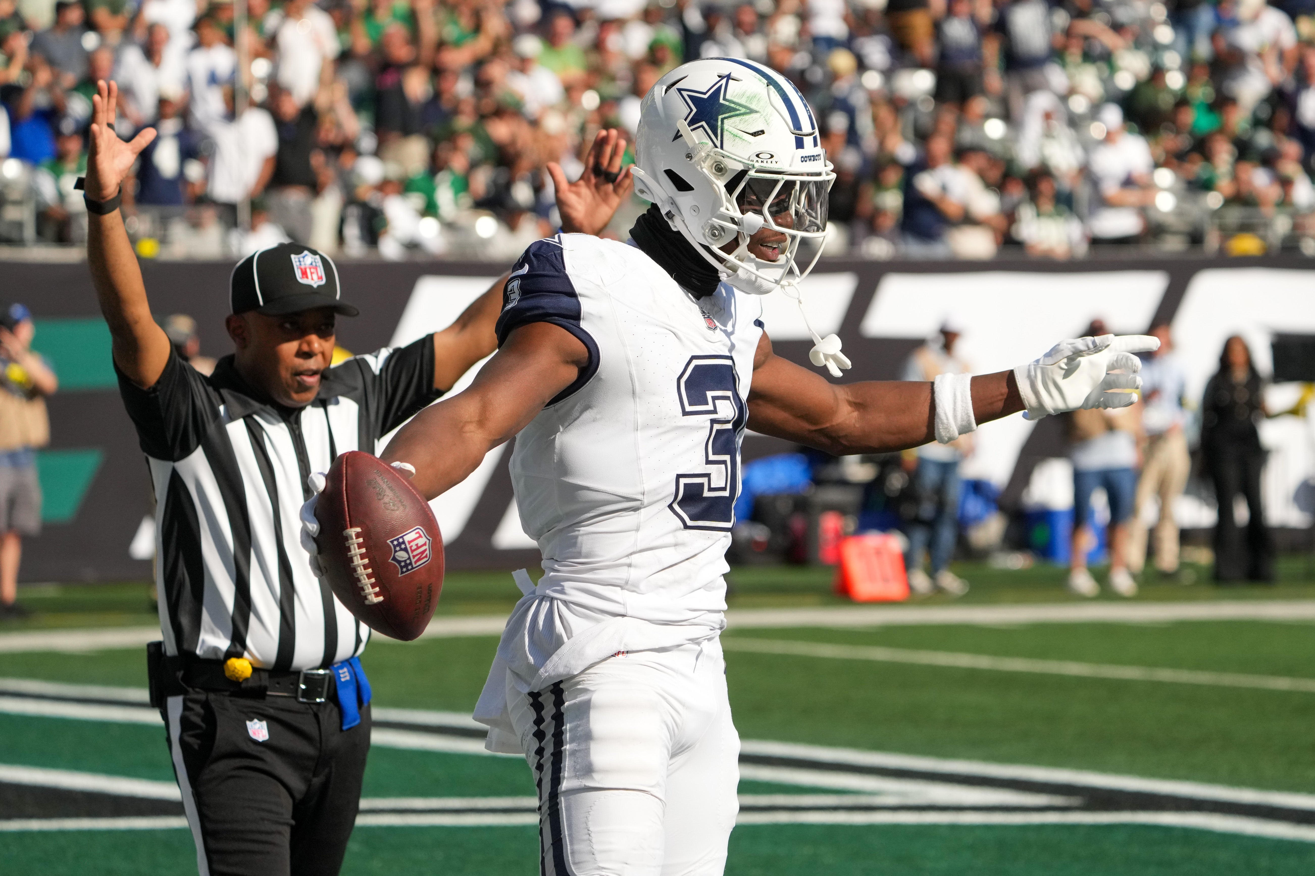 Oct 5, 2025; East Rutherford, New Jersey, USA; Dallas Cowboys wide receiver George Pickens (3) reacts after catching a touchdown against the New York Jets during the second half at MetLife Stadium.